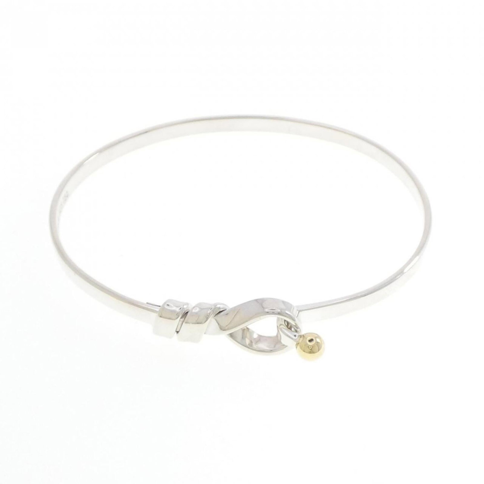 TIFFANY Bangle Silver 925 Yellow Gold (18K): TIFFANY Bangle Silver 925 Yellow Gold (18K) Silver 925 and 18K yellow gold come together in this elegant bangle, a timeless piece that exudes sophistication. Measuring 16.5cm in length, it boasts a