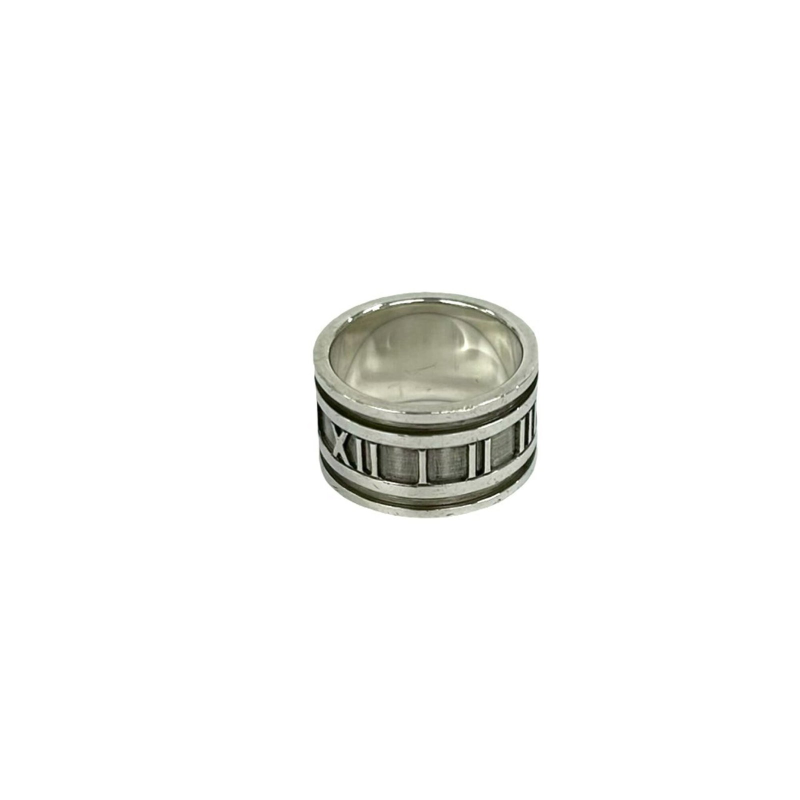 TIFFANY Band Ring Silver 925: TIFFANY Band Ring Silver 925 Silver 925 Tiffany band ring, a classic design with a subtle sheen, is available in a US size 6.5. The ring features a silver band with visible wear and scratches, giving 