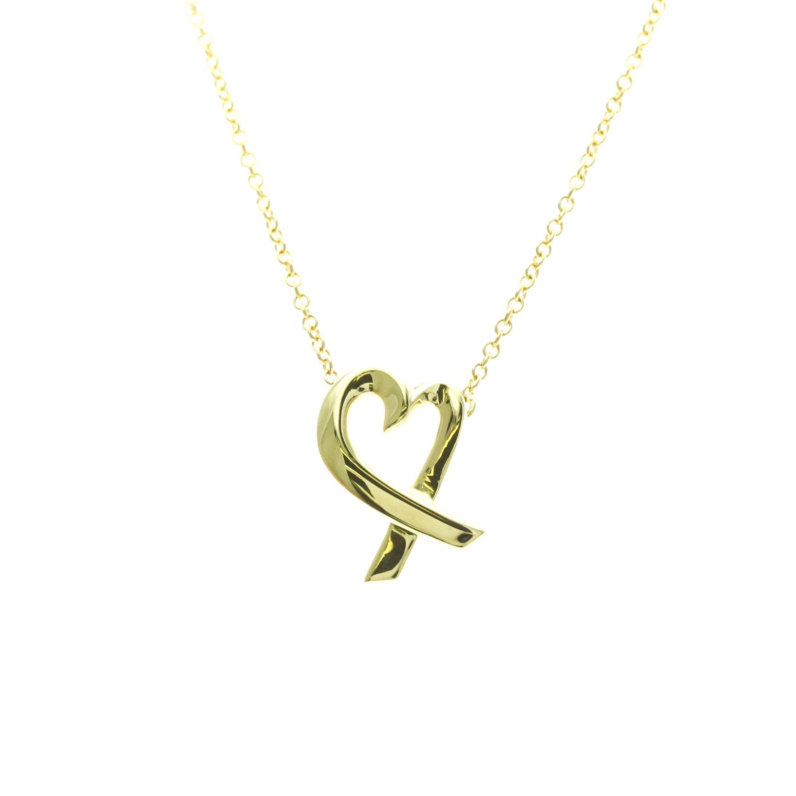 TIFFANY Yellow Gold (18K): TIFFANY Yellow Gold (18K) Yellow gold (18K) pendant necklace with a classic Loving Heart design, crafted from 18K gold for a touch of timeless elegance. This gently used necklace features a 14mm x