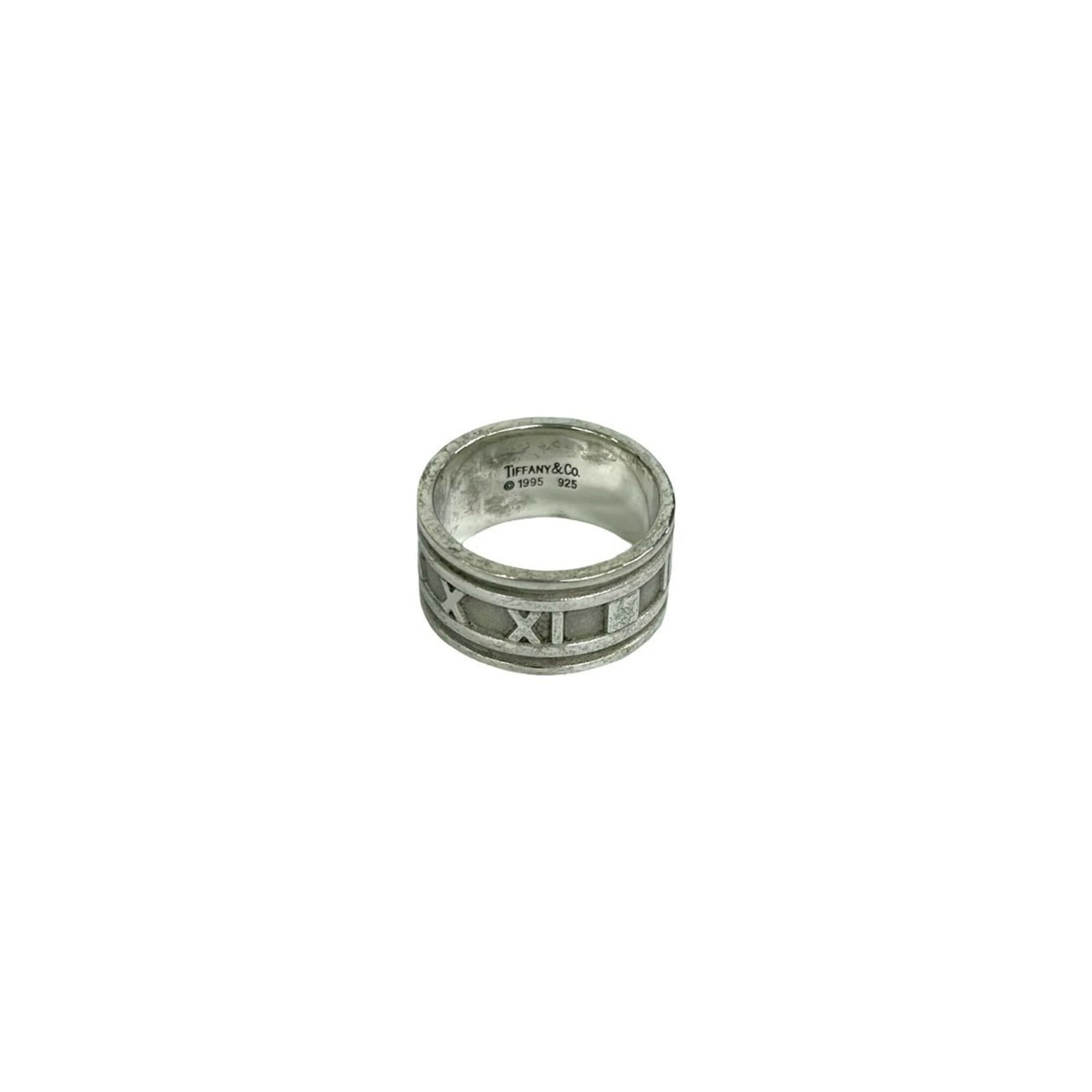 TIFFANY Band Ring Silver 925: TIFFANY Band Ring Silver 925 Silver 925 band ring from Tiffany, featuring a classic design, is available for purchase. This women's band ring showcases a silver finish with visible wear and scratches,