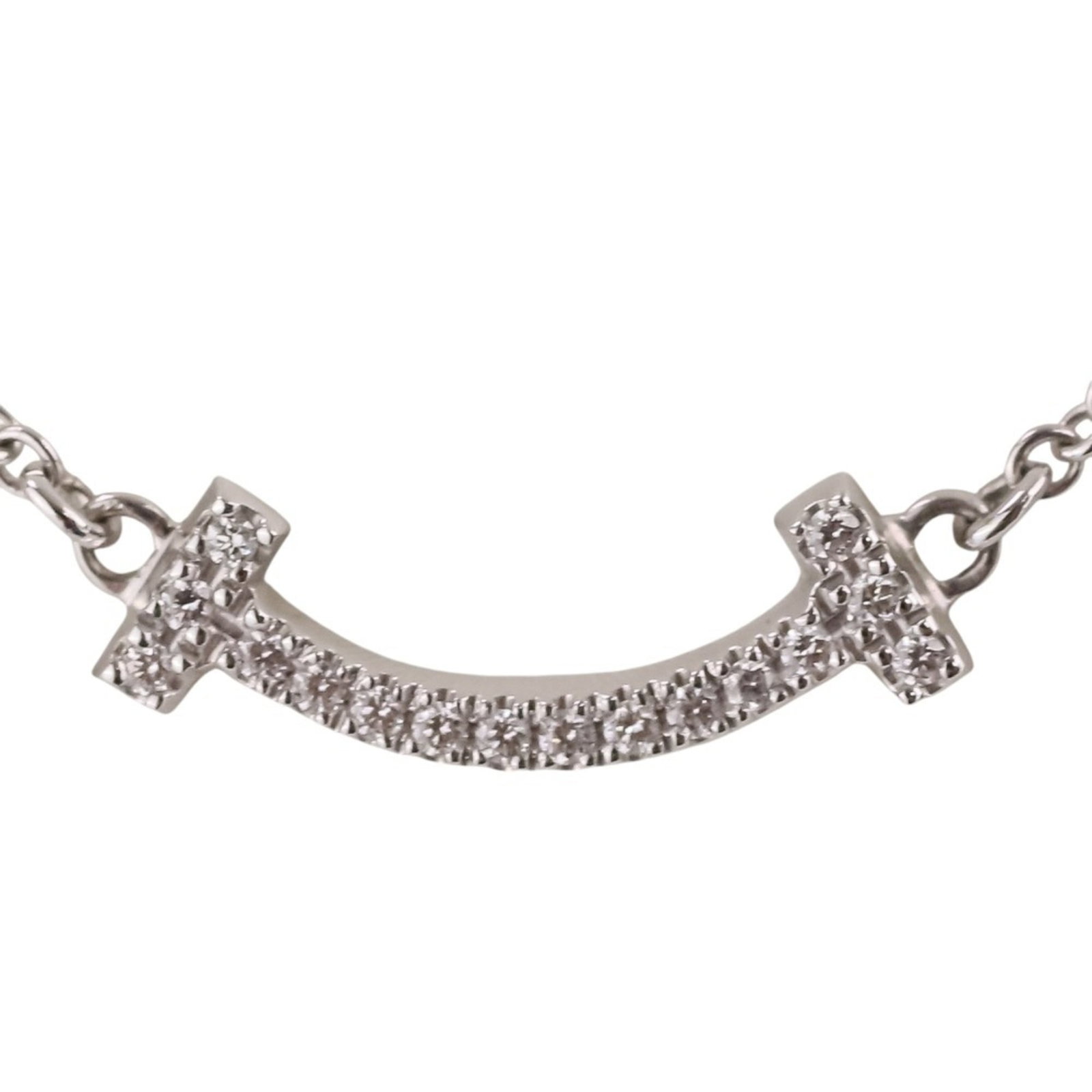 TIFFANY White Gold (18K): TIFFANY White Gold (18K) Tiffany's iconic white gold (18K) necklace boasts a sleek design with a pendant that measures 0.4mm x 1.4mm. This 46 cm long necklace features a high-quality white gold