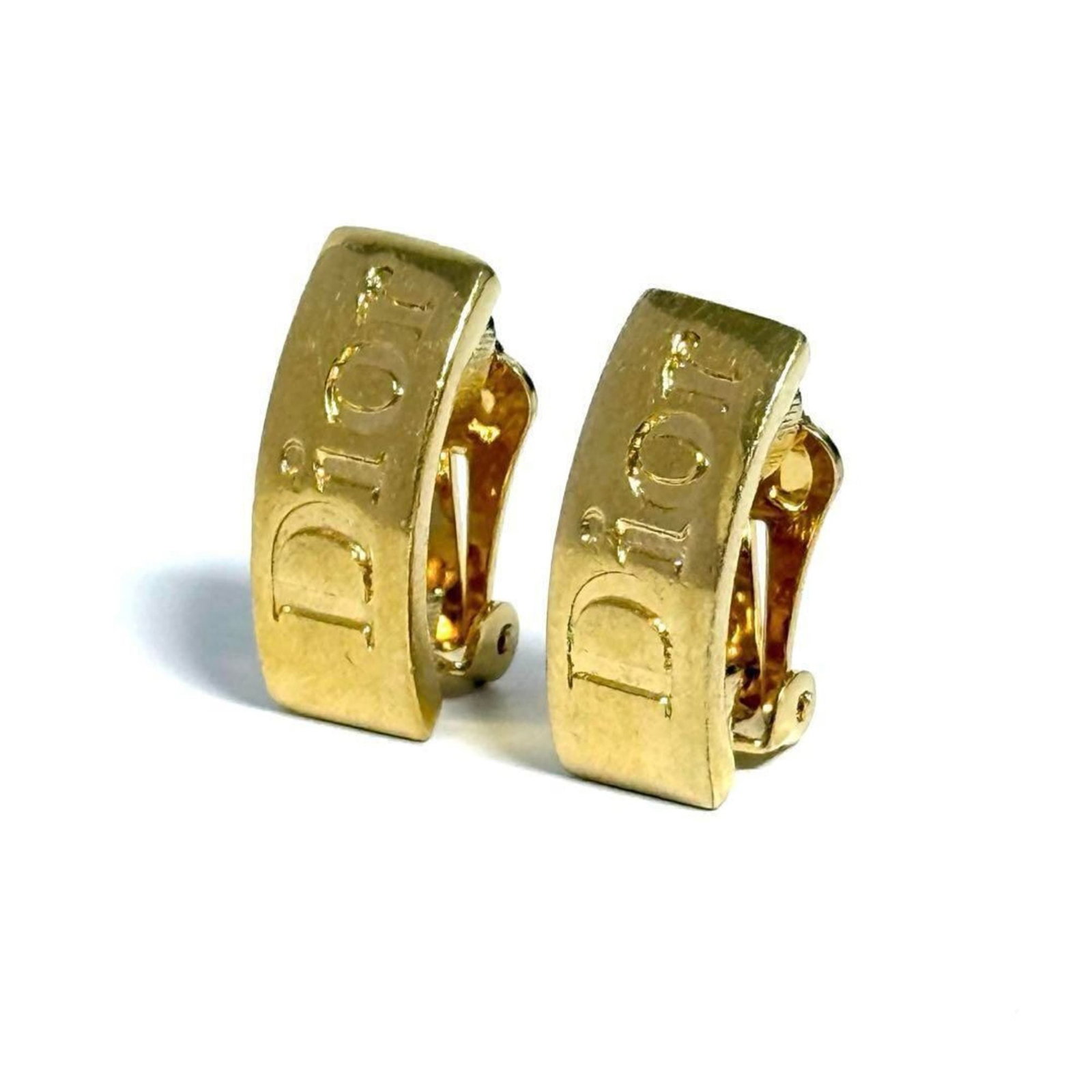 CHRISTIAN DIOR Clip Earrings Metal: CHRISTIAN DIOR Clip Earrings Metal Gold Clip Earrings from Christian Dior, featuring a metal design with minor scratches and light marks, are available in very good condition. Gently used, these clip