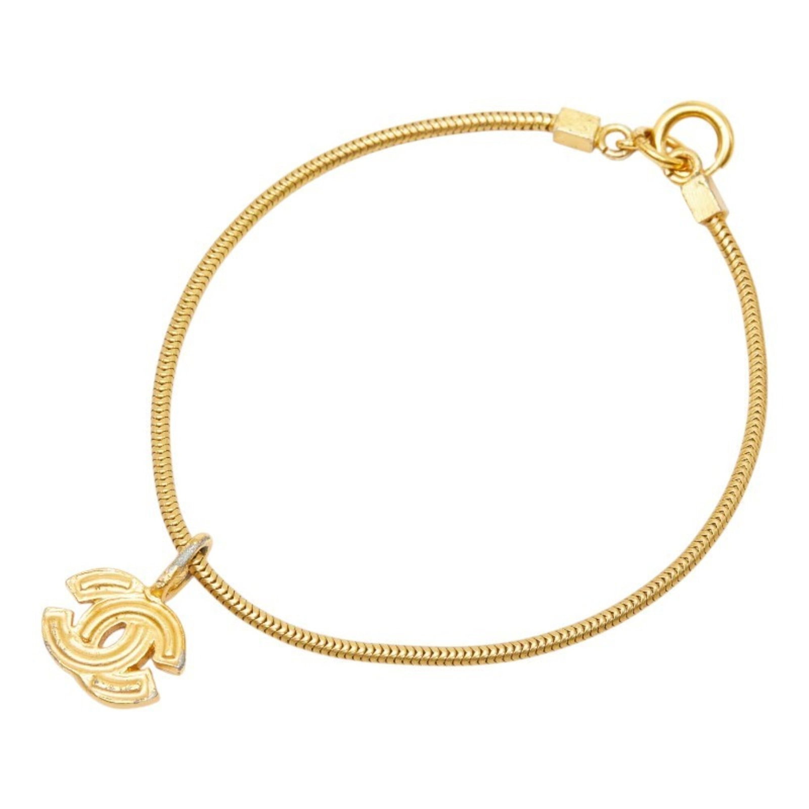 CHANEL Charm Bracelet Gold Plating: CHANEL Charm Bracelet Gold Plating Gold plating adds a touch of luxury to this classic CHANEL charm bracelet, available in a 19.5cm length. The item features visible wear, including scratches and