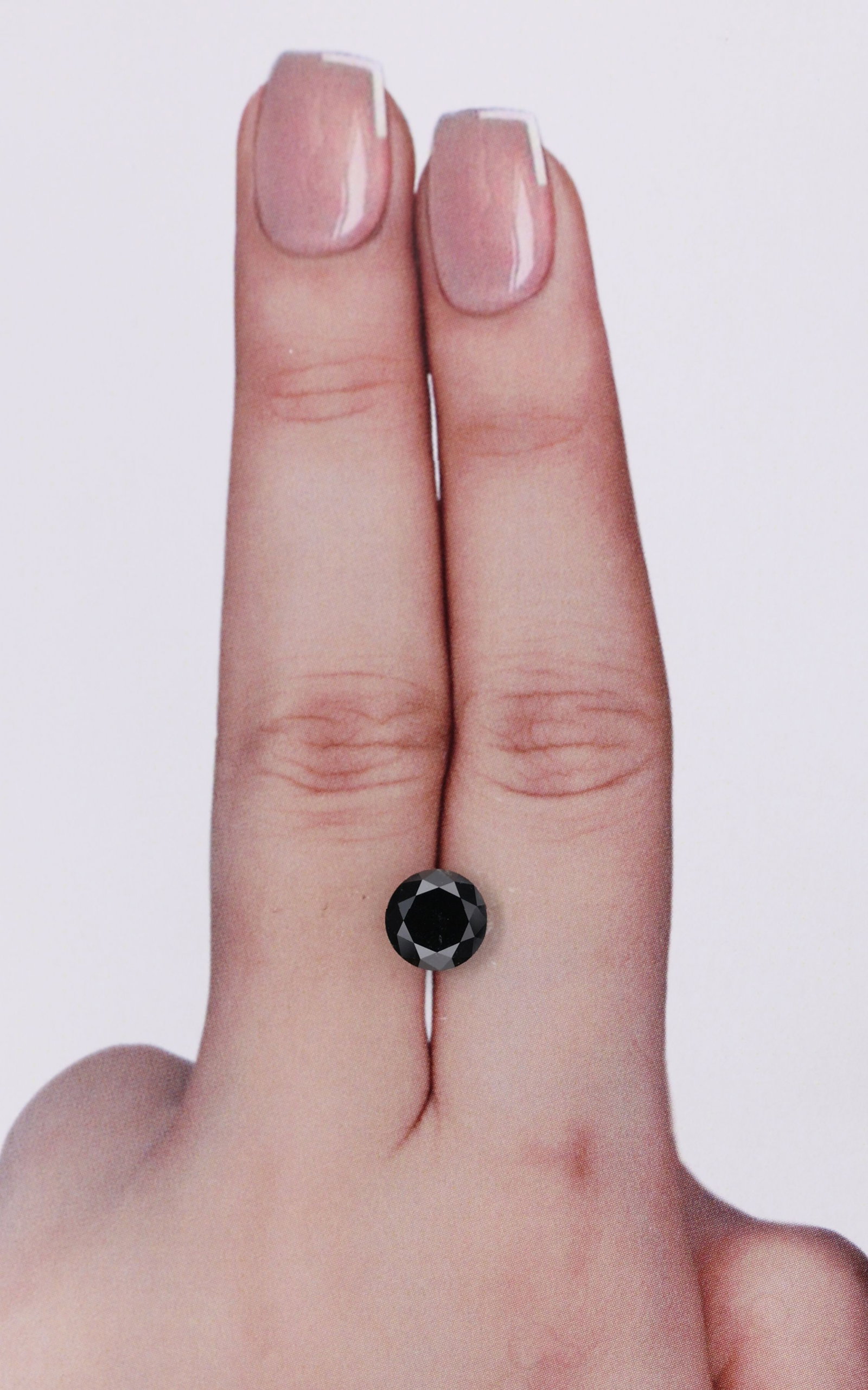 Round 1.21ct Fancy Black VVS2 - Loose Natural Diamond: Round 1.21ct Fancy Black VVS2 - Loose Natural Diamond The 1.21ct Fancy Black VVS2 diamond boasts exceptional clarity and color, with its EX polish and symmetry showcasing its exceptional cut. This