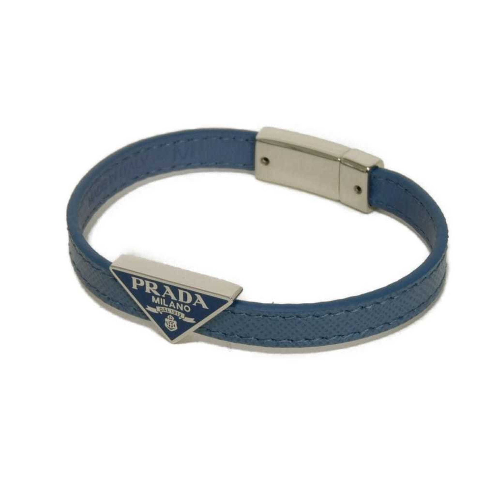 PRADA Charm Bracelet Leather Saffiano Triangle: PRADA Charm Bracelet Leather Saffiano Triangle Saffiano leather triangle charm bracelet from Prada, Italy, featuring a striking blue color and a sleek design. Made from high-quality Saffiano leather, 