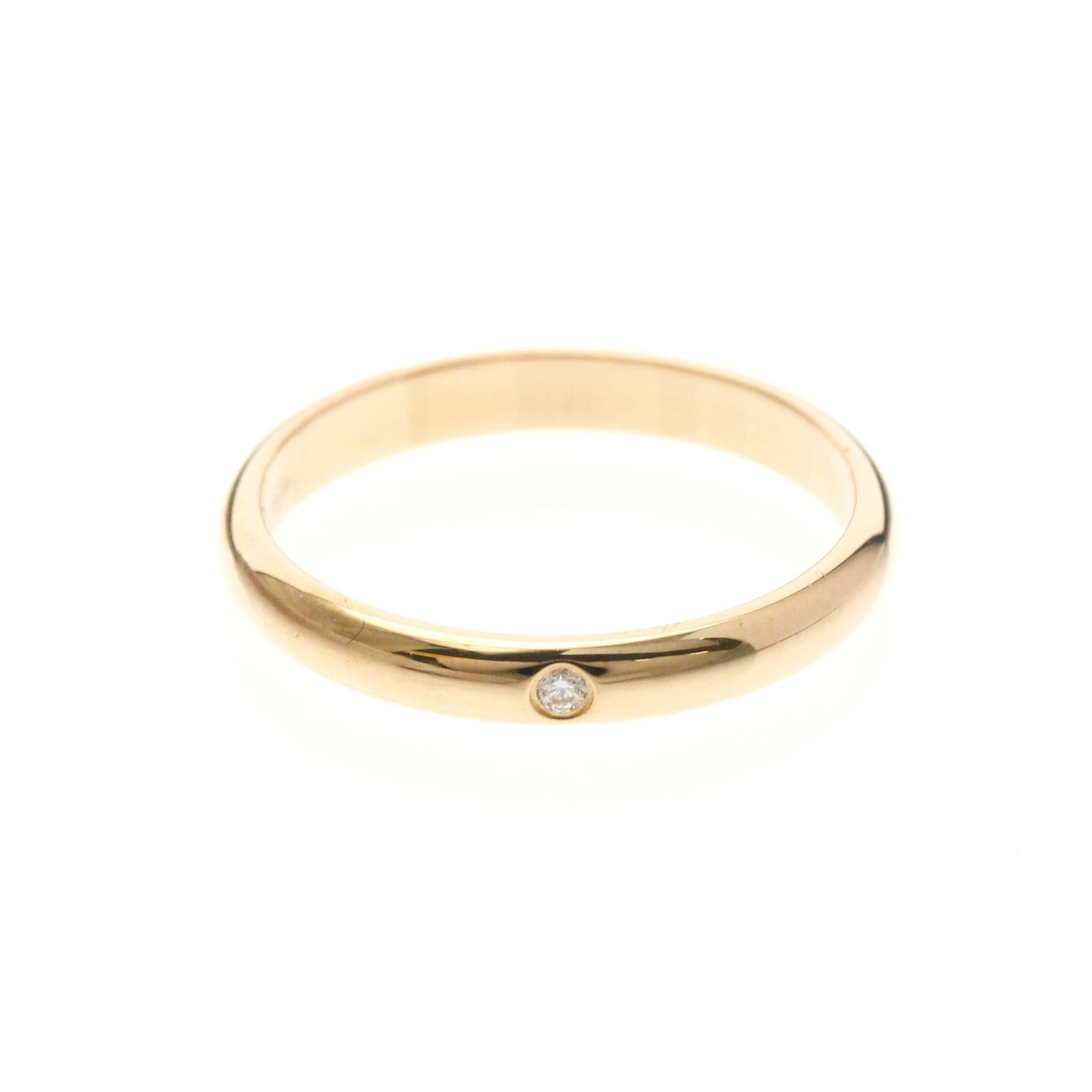 CARTIER Band Ring Pink Gold (18K): CARTIER Band Ring Pink Gold (18K) Pink gold (18K) band ring from Cartier's 1895 Wedding Ring model, featuring a diamond set into a sleek and sophisticated design. This gently used ring showcases a sub