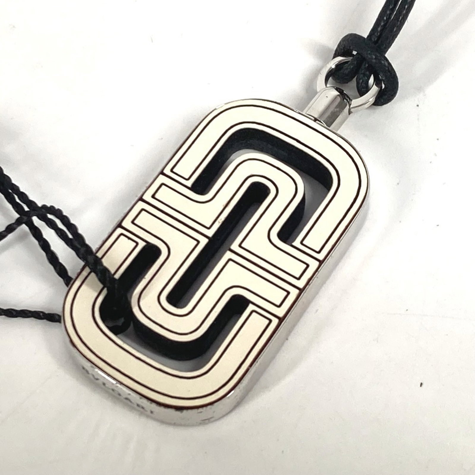 BVLGARI Leather Black White: BVLGARI Leather Black White BVLGARI Leather Black White Necklace is a statement piece featuring a unique blend of black and white leather. The necklace boasts a distinctive design with visible scratch