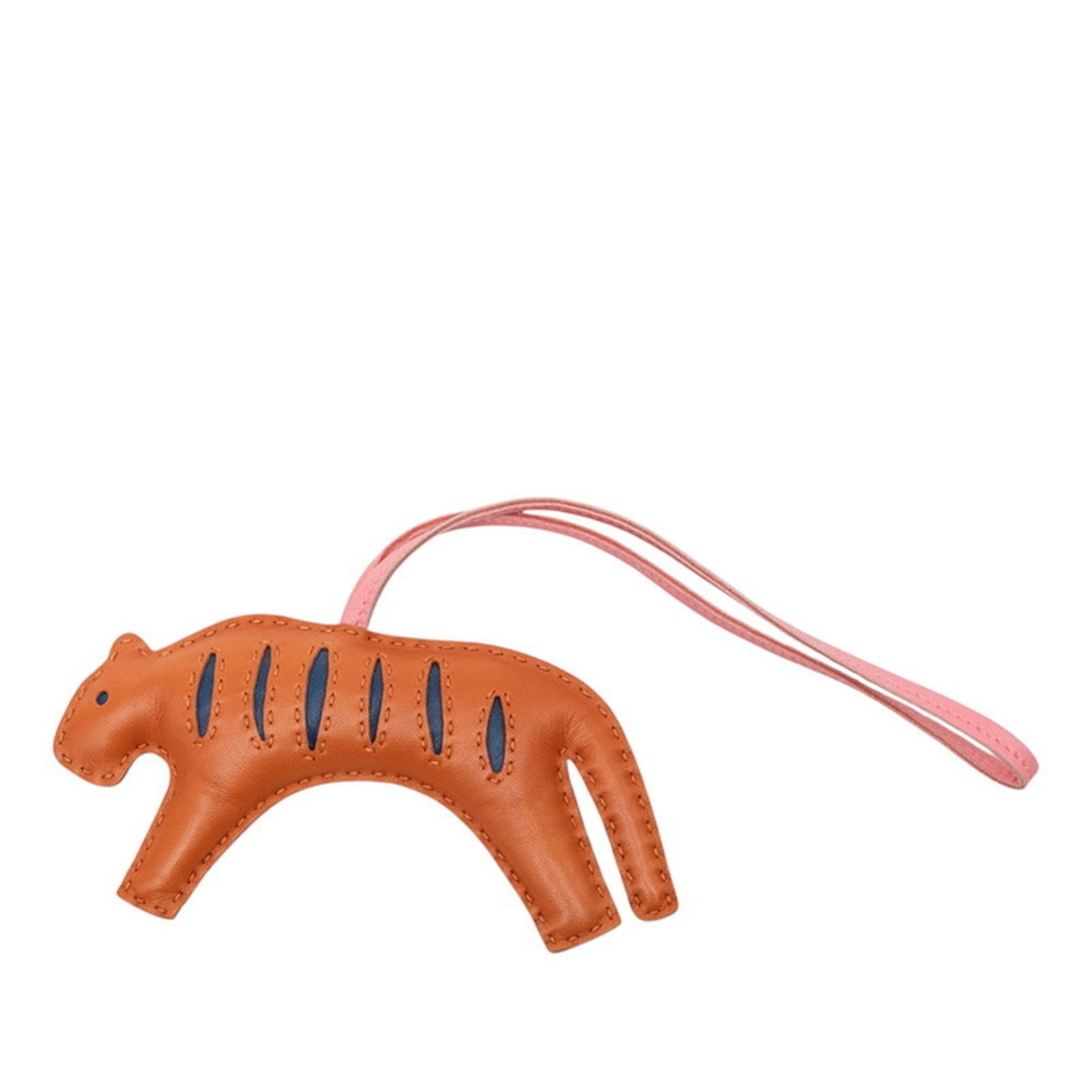 HERMES Handbag Charm Agneau Milo: HERMES Handbag Charm Agneau Milo Agneau Milo charm from Hermes, a handbag charm with a rich, earthy tone. This charm features a beautiful, natural material with visible scratches and scuffs, giving
