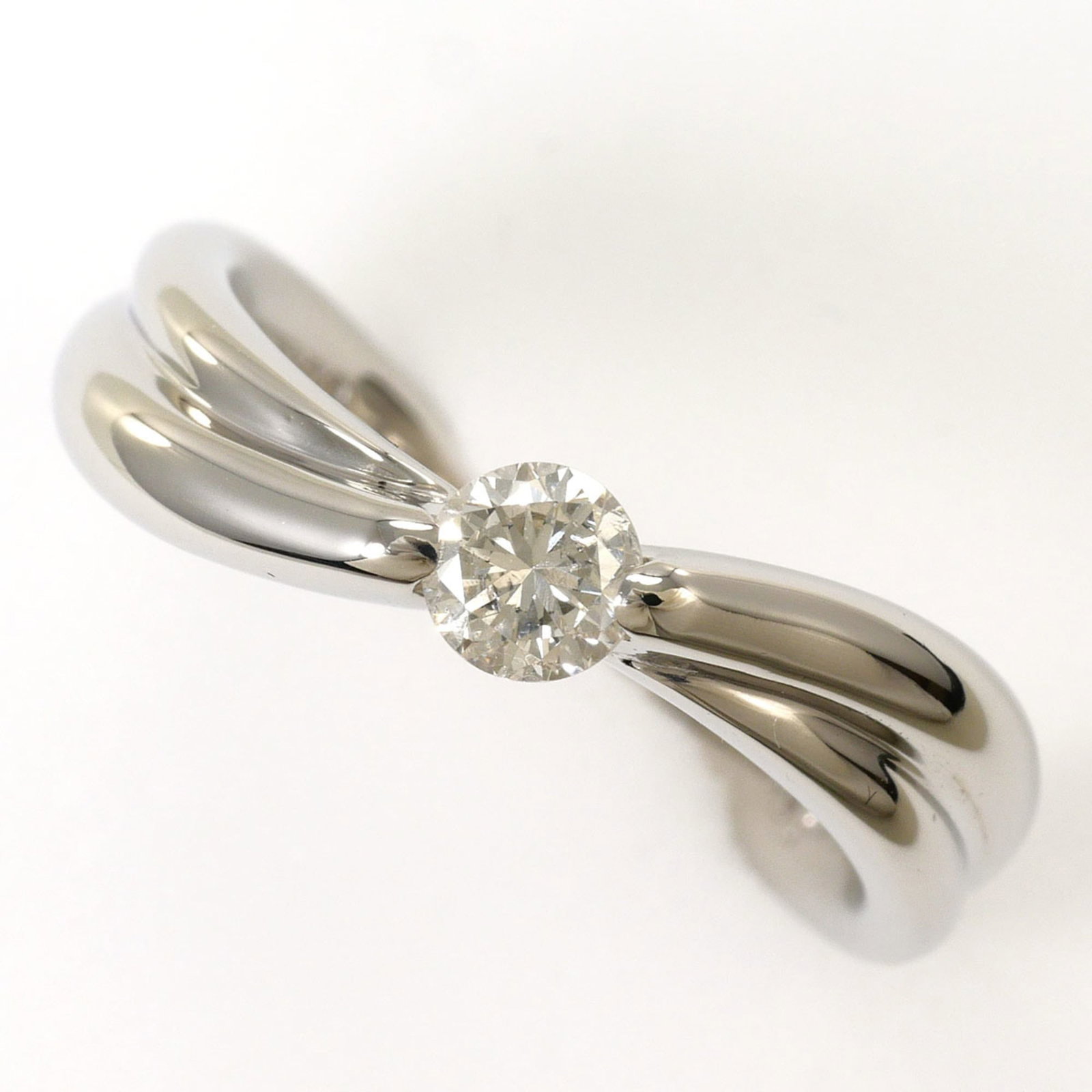Band Ring Platinum 1000: Band Ring Platinum 1000 Platinum 1000 band ring features a sleek 5mm width and a diamond stone weighing 0.26 carats, set in a sturdy platinum band. Made from high-quality platinum metal, this ring