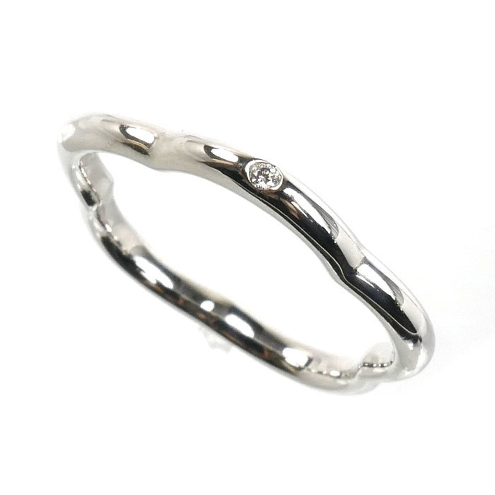CHANEL Band Ring White Gold (18K): CHANEL Band Ring White Gold (18K) White gold (18K) band ring from CHANEL, crafted in France, features a diamond stone and a classic design. This gently used ring shows minor signs of wear, with small