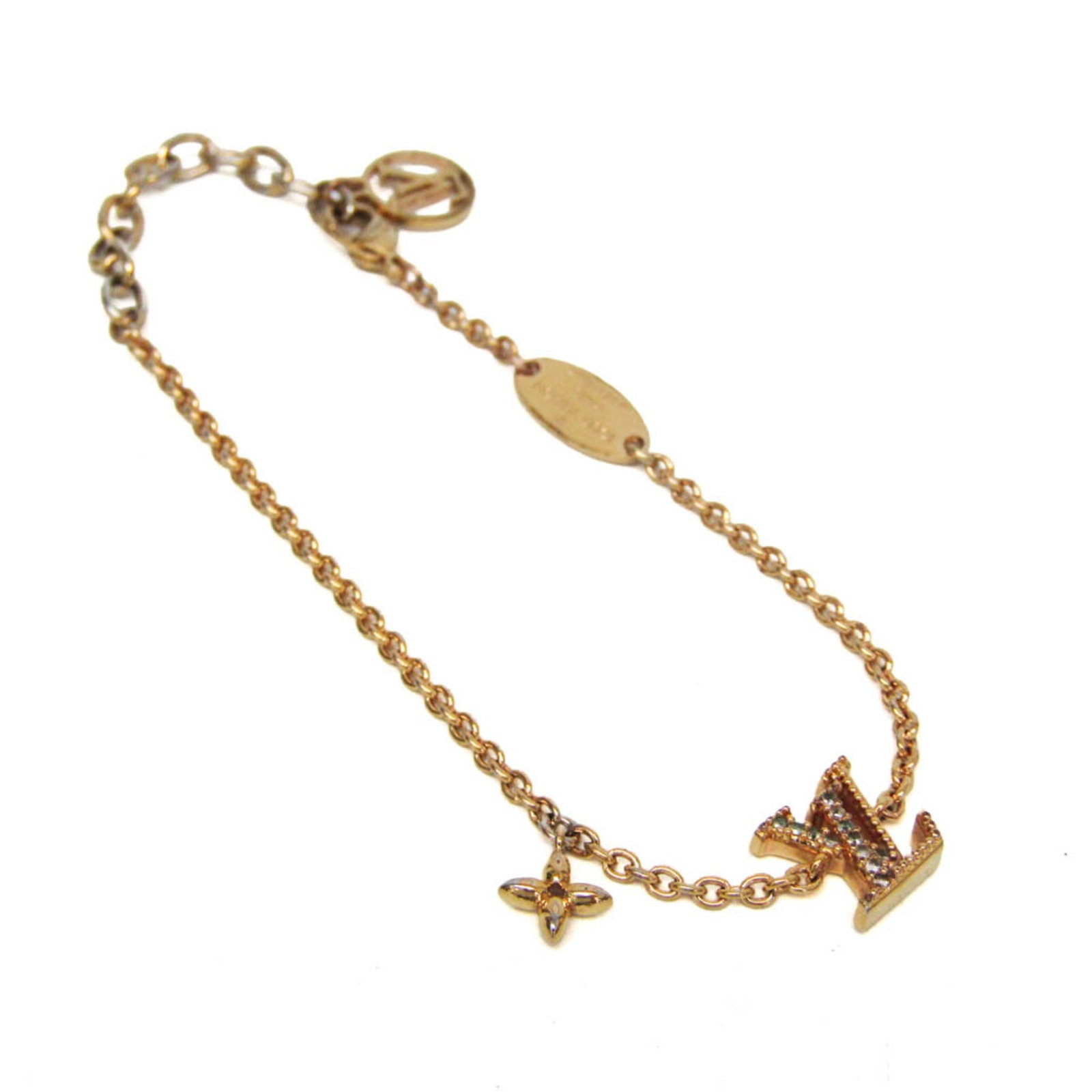 LOUIS VUITTON Charm Bracelet Metal Rhinestone: LOUIS VUITTON Charm Bracelet Metal Rhinestone Gold charm bracelet from Louis Vuitton, featuring metal and rhinestone details, measures 14.5-18cm in length and weighs 3.9g. The bracelet bears a