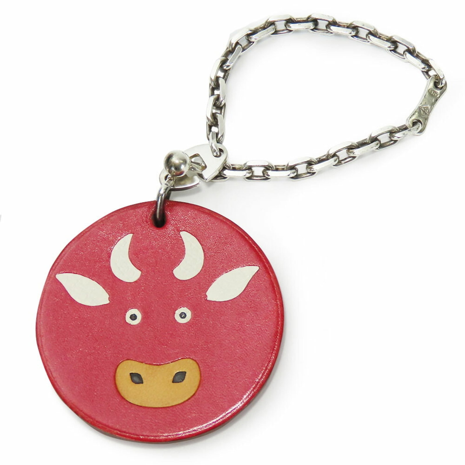 HERMES Handbag Charm Leather Silver 925: HERMES Handbag Charm Leather Silver 925 Leather and silver 925 charm from the iconic Hermes brand, featuring a striking red color. This gently used charm measures 41mm x 41mm and weighs 11.3g, with mi