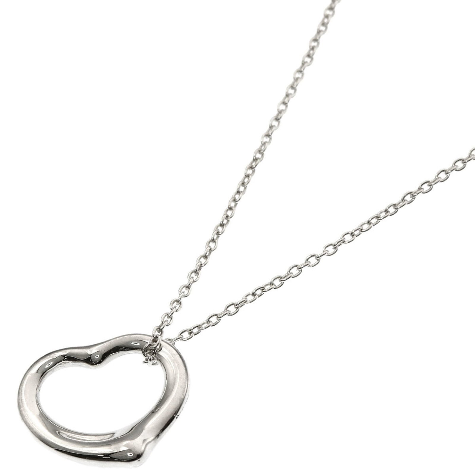 TIFFANY Silver Necklace: TIFFANY Silver Necklace Tiffany's iconic silver necklace boasts a sleek 14mm x 14.8mm pendant, suspended from a 41.5 cm chain. Gently used with minor signs of wear, this piece still shines with its