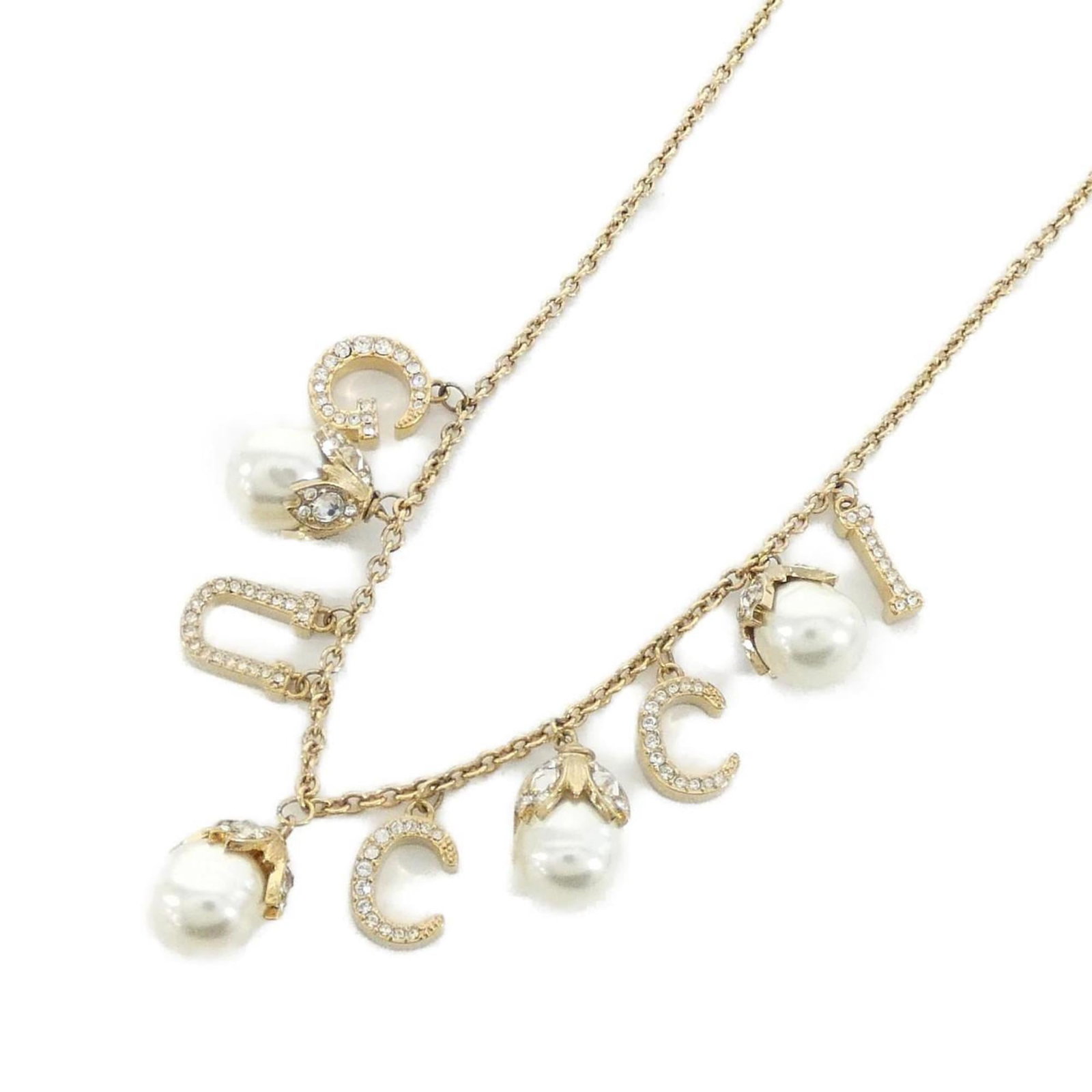 GUCCI Clear Gold White: GUCCI Clear Gold White Gucci Clear Gold White Necklace - A sleek and modern accessory featuring a clear, gold, and white pendant. Measuring 15mm x 11mm, this necklace is designed to complement any