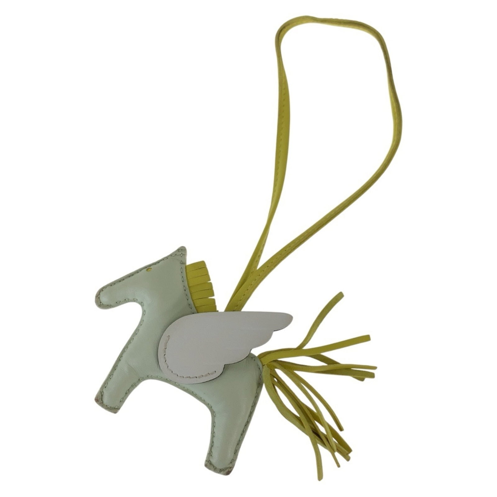 HERMES Handbag Charm Agneau Milo: HERMES Handbag Charm Agneau Milo Agneau Milo charm from Hermes, a French luxury brand, features a lime and white design. This handbag charm is made from Agneau Milo material and measures 75.00mm x 80.