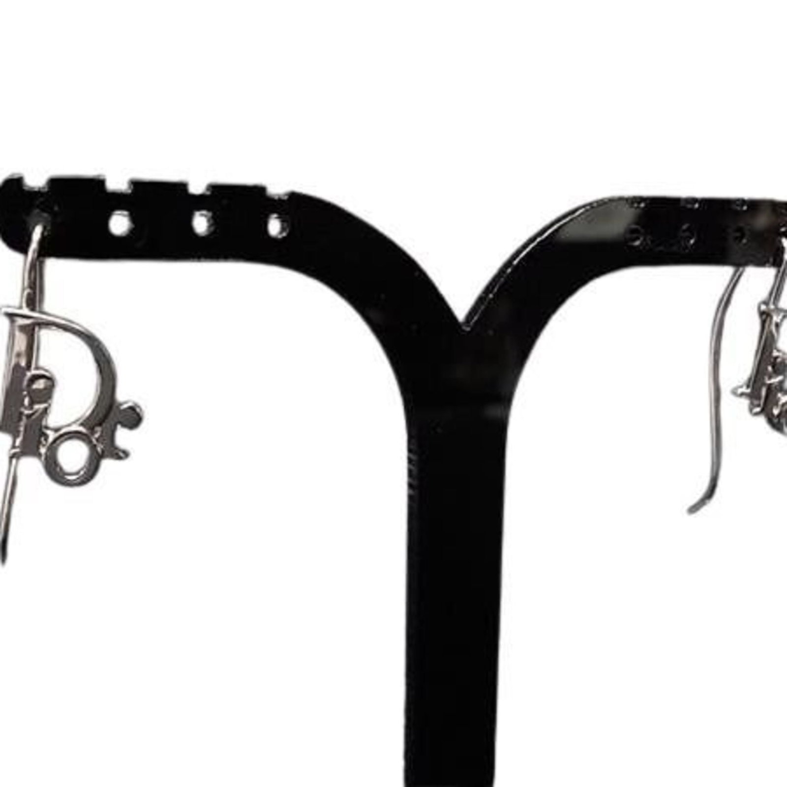 CHRISTIAN DIOR Drop Earrings Metal: CHRISTIAN DIOR Drop Earrings Metal Silver Drop Earrings by Christian Dior, featuring a metal design with a subtle elegance. Gently used with minor signs of wear, these earrings showcase a classic