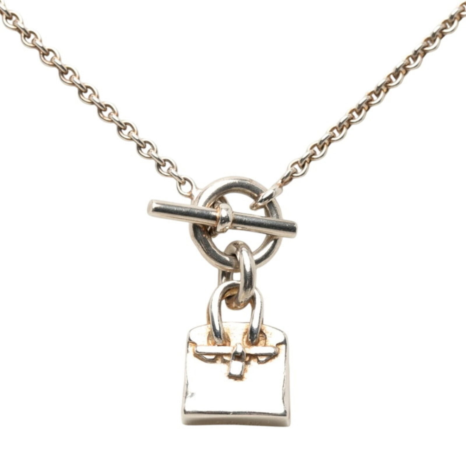 HERMES Silver Silver 925: HERMES Silver Silver 925 Silver 925 Pendant from Hermes Necklace, 15.8mm x 12mm, Good Used Condition with Visible Wear. This silver necklace features a 925 sterling silver pendant with scratches and