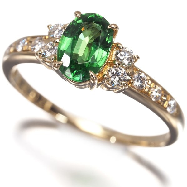 Tasaki Ring Grossular Garnet 0.81Ct Diamond 0.18Ct Us5.5-5.75 18K Yg: Tasaki Ring Grossular Garnet 0.81Ct Diamond 0.18Ct Us5.5-5.75 18K Yg Tasaki Ring features a stunning 0.81ct Grossular Garnet surrounded by a delicate setting, complemented by a 0.18ct diamond. The
