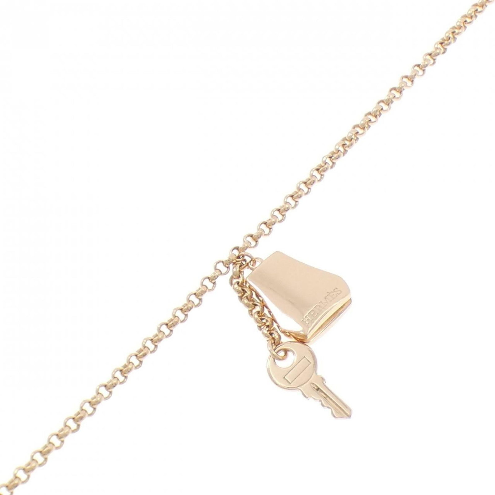 HERMES Charm Bracelet Pink Gold (18K): HERMES Charm Bracelet Pink Gold (18K) Pink gold (18K) charm bracelet from Hermes, featuring a delicate pink gold chain and a refined design. This 17cm long charm bracelet is presented in excellent