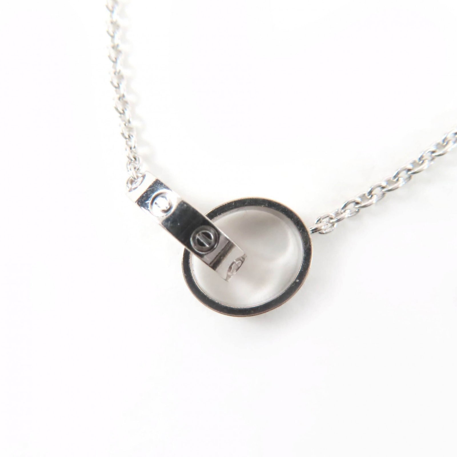 CARTIER White Gold (18K): CARTIER White Gold (18K) White gold (18K) Cartier necklace features a 10mm x 17mm pendant in excellent condition, with no visible wear or only the faintest traces. The pendant is suspended from a 44