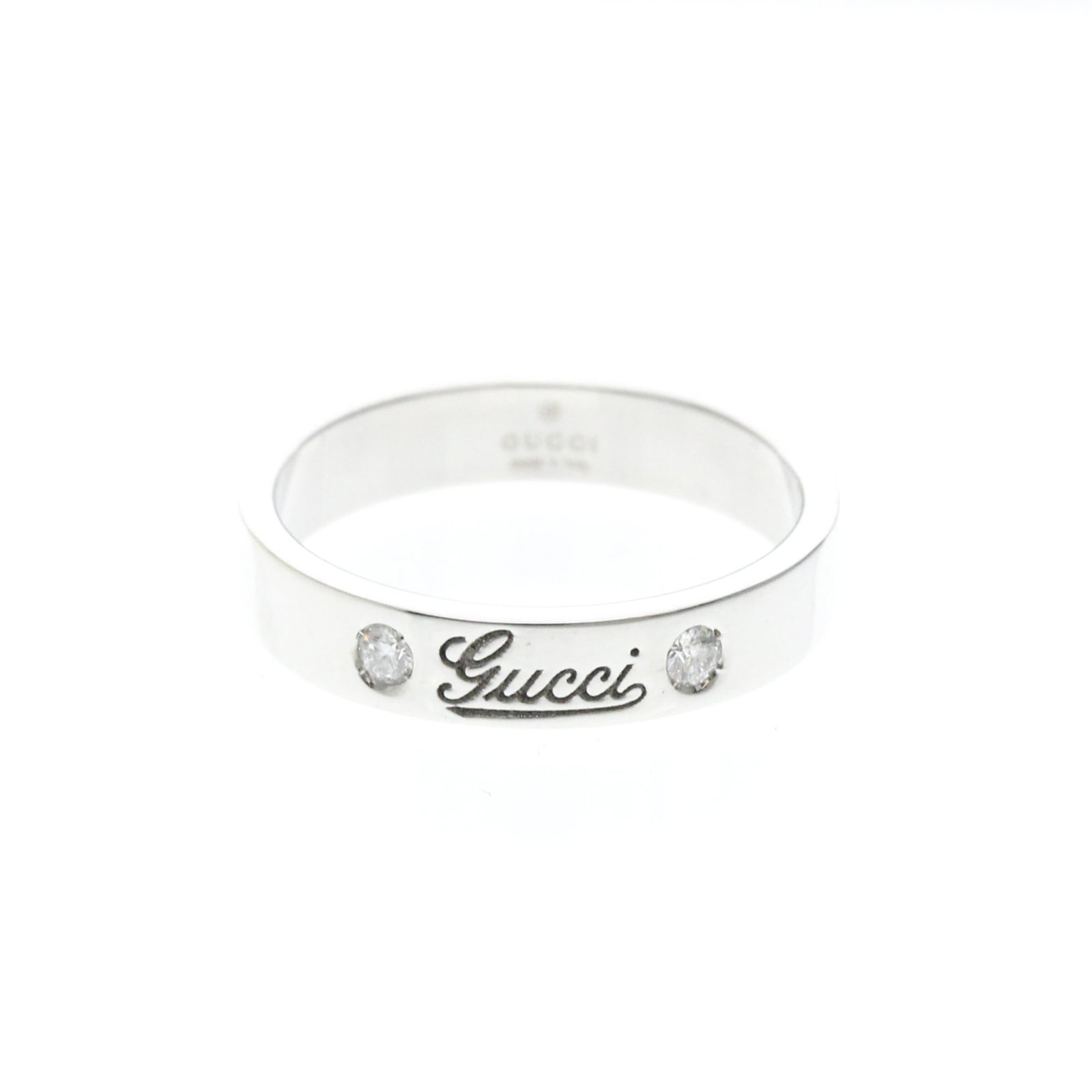 GUCCI Band Ring White Gold (18K): GUCCI Band Ring White Gold (18K) Gucci's iconic print band ring is a stylish accessory that adds a touch of luxury to any outfit. This 18K white gold ring features a subtle diamond accent and a classi