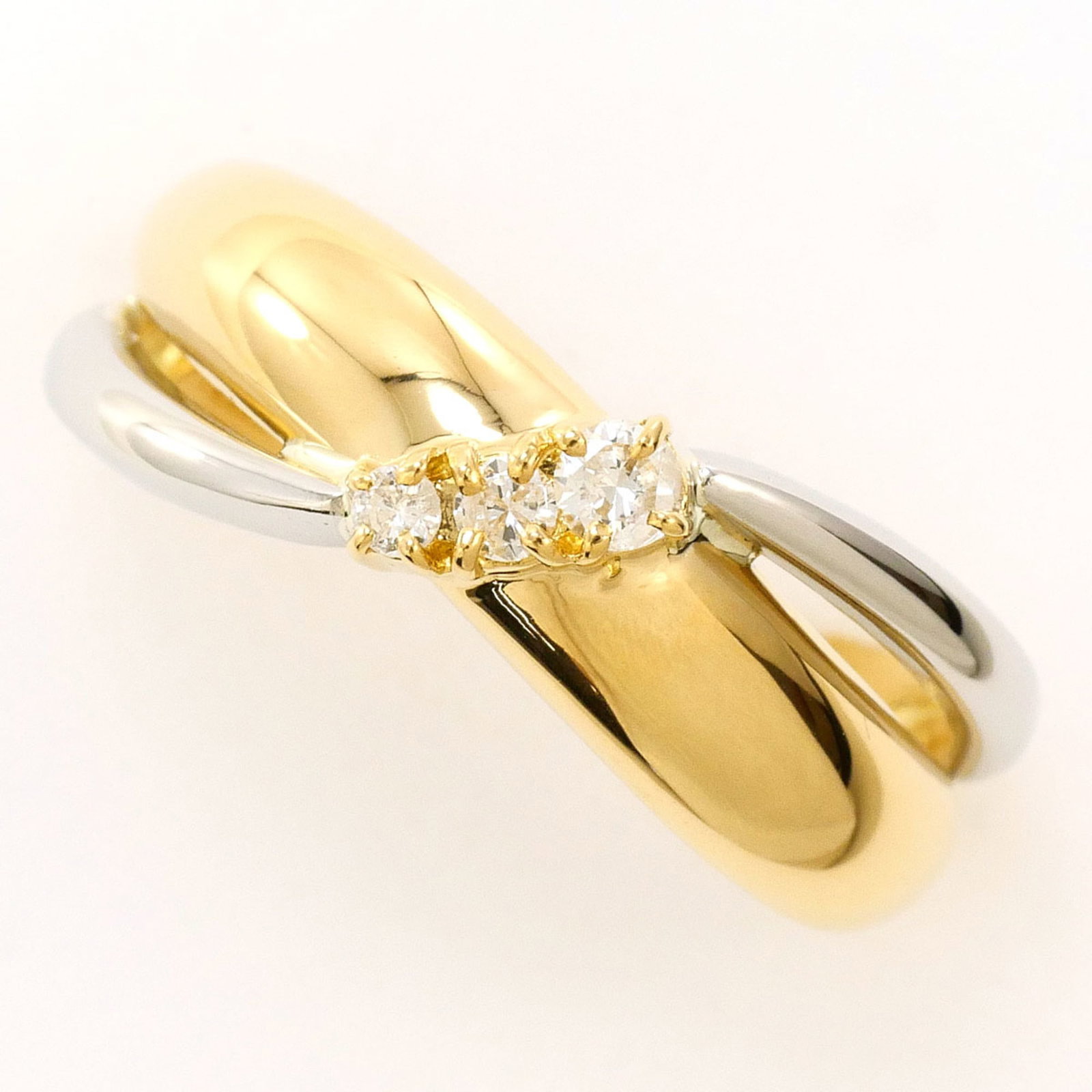 Band Ring Platinum 900 Yellow Gold (18K): Band Ring Platinum 900 Yellow Gold (18K) Platinum 900 Yellow Gold (18K) band ring features a 0.10ct diamond, set in a 7mm wide band with a US size 5 fit. Made from 18K gold and platinum, this ring boa