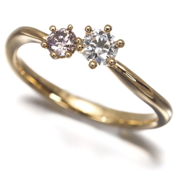 Clear&Pink Diamond 0.194Ct/0.120Ct Ring 18K 750 Yellow Gold X 2: Clear&Pink Diamond 0.194Ct/0.120Ct Ring 18K 750 Yellow Gold X 2 Yellow gold 18k ring features a striking clear and fancy brownish pink diamond, weighing 0.194ct and 0.120ct, set in a beautiful