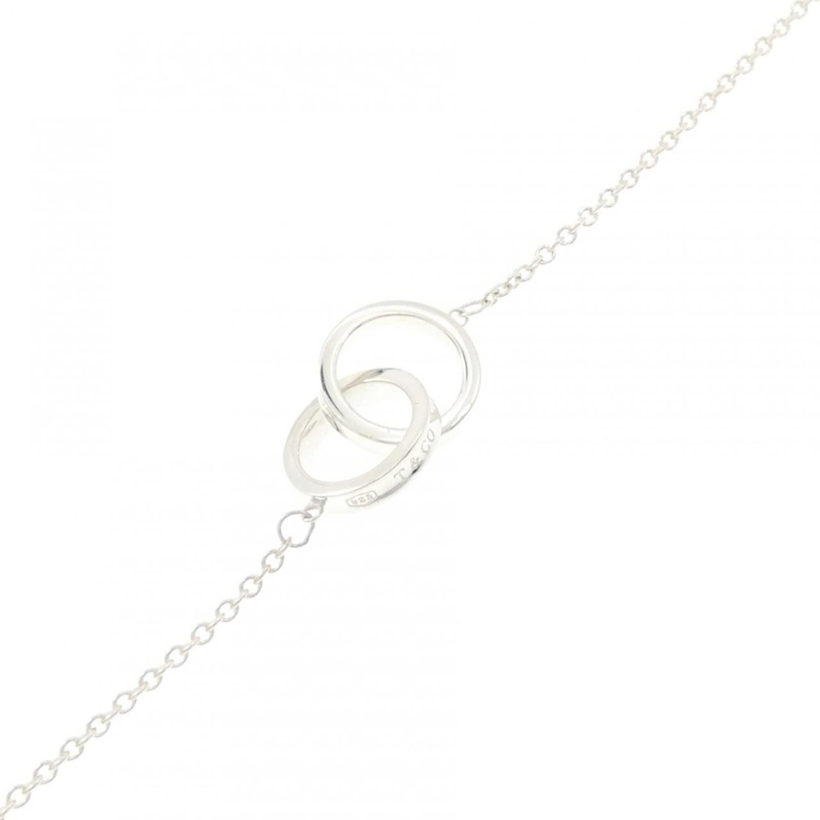 TIFFANY Charm Bracelet Silver 925: TIFFANY Charm Bracelet Silver 925 Silver 925 Charm Bracelet from Tiffany, featuring a delicate design with a subtle charm. This like-new used bracelet measures 15cm-18cm in length and boasts