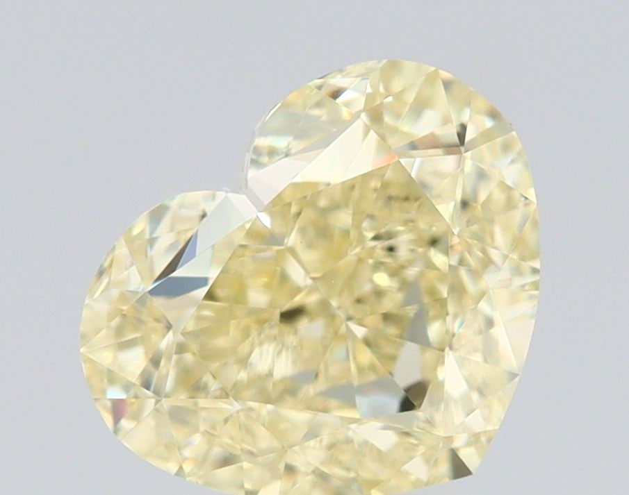 GIA Heart 2.01ct Fancy Light Yellow VVS2 - Loose Natural Diamond: GIA Heart 2.01ct Fancy Light Yellow VVS2 - Loose Natural Diamond GIA-certified, this 2.01ct Fancy Light Yellow VVS2 diamond boasts exceptional clarity and a vibrant, sunny hue. Its impressive cut and