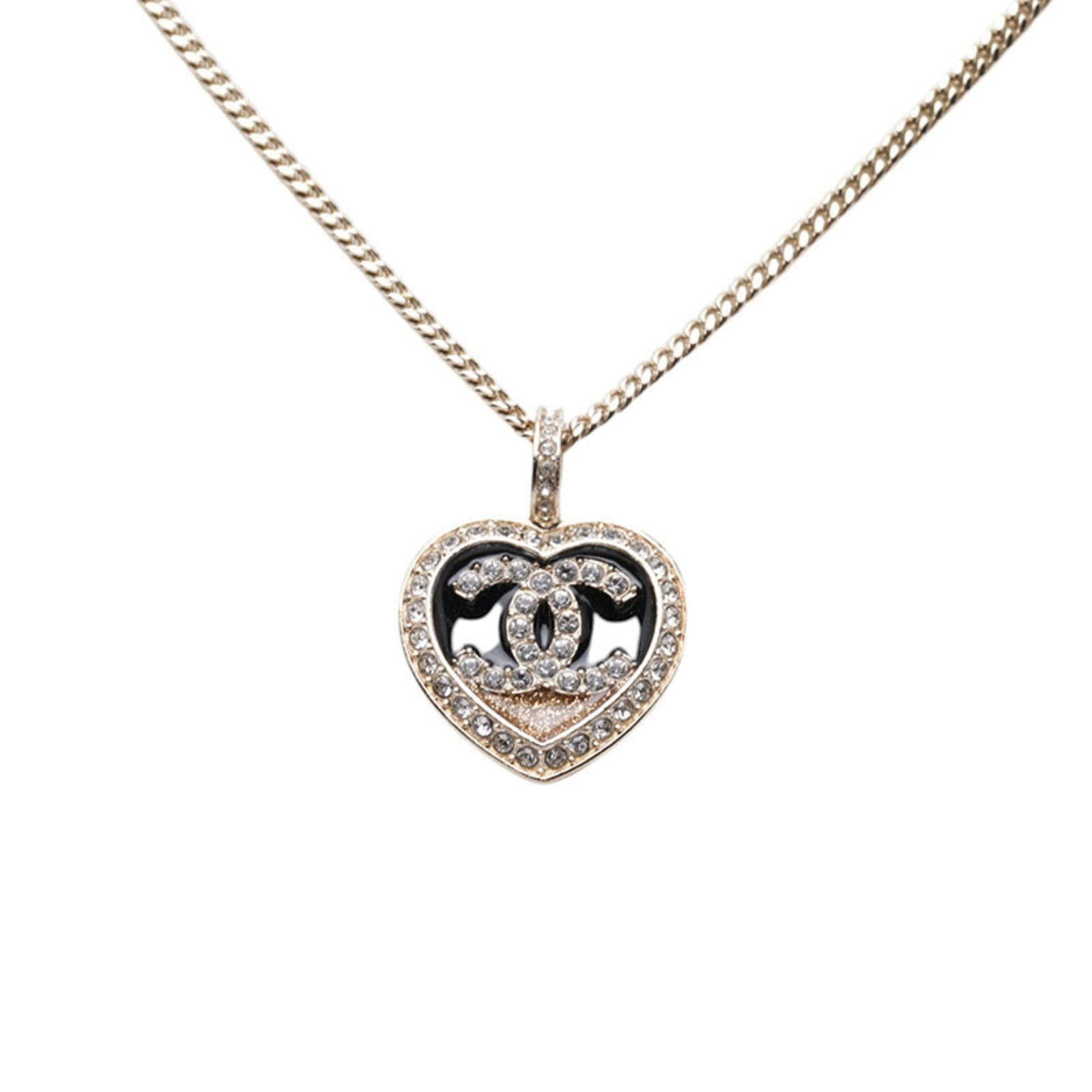 CHANEL Rhinestone Black Gold: CHANEL Rhinestone Black Gold Rhinestones and black gold come together in this striking Chanel necklace, boasting a 45 cm / 17.71'' adjustable neck and a 17.8mm x 18.4mm rhinestone pendant. The necklac