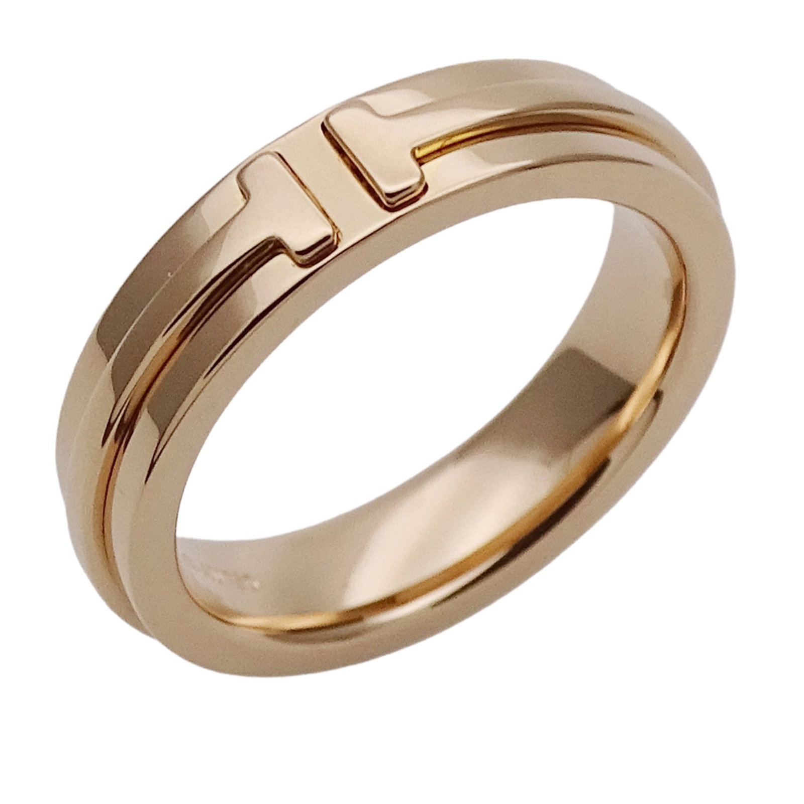 TIFFANY Band Ring Pink Gold (18K): TIFFANY Band Ring Pink Gold (18K) Pink gold band ring from Tiffany, crafted in 18K Swiss gold, features a subtle pink hue. This band ring is in good condition, with visible wear and minor scratches, a