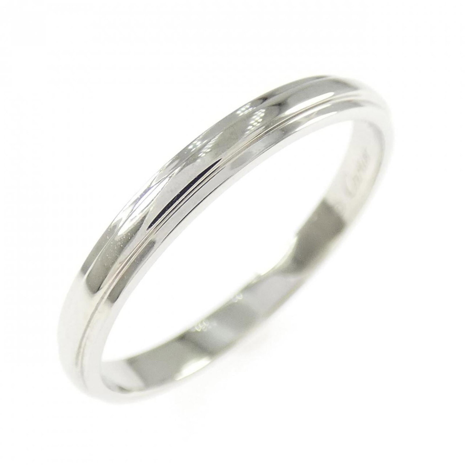 CARTIER Band Ring Platinum 950: CARTIER Band Ring Platinum 950 Platinum 950 Cartier Band Ring, a sophisticated and elegant accessory, boasts a sleek design that exudes refinement. Gently used with minor signs of wear, this band ring