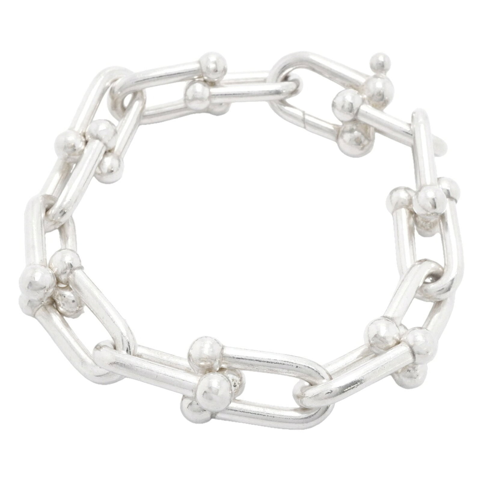 TIFFANY Charm Bracelet Silver 925: TIFFANY Charm Bracelet Silver 925 Silver 925 Tiffany charm bracelet with visible scratches and scuffs, offering a unique, pre-owned piece with a distinctive charm. The 17.5cm length provides a