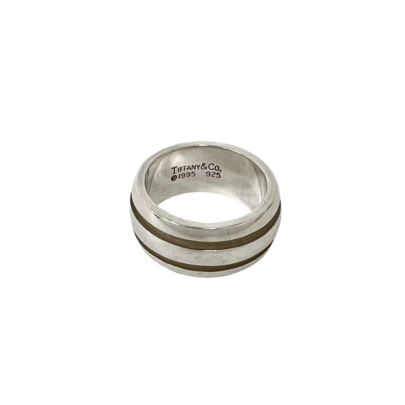 TIFFANY Band Ring Silver 925: TIFFANY Band Ring Silver 925 Silver 925 band ring from Tiffany, a classic design featuring a sleek and modern silhouette. The item bears visible signs of wear, including scratches and scuffs, but rema