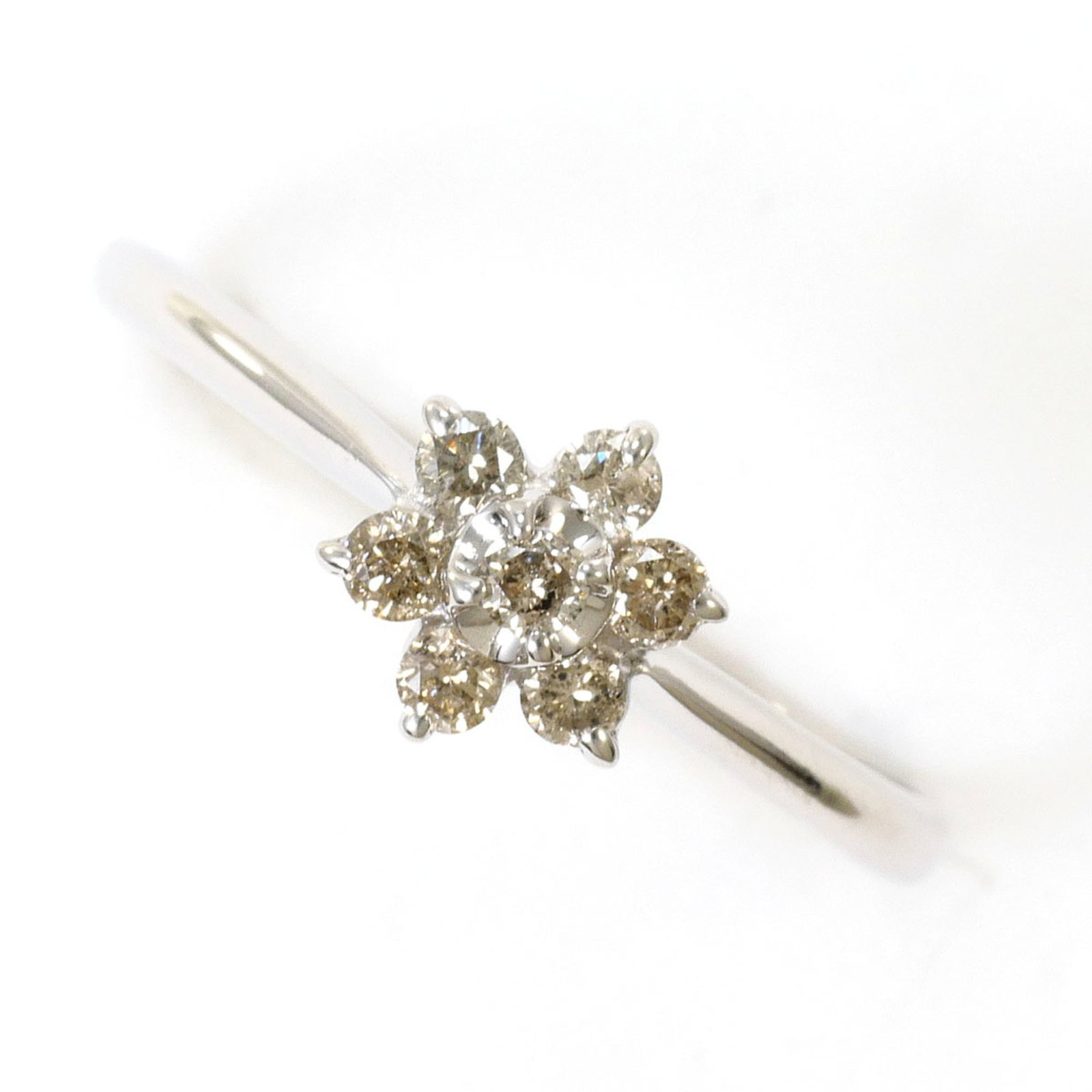 Band Ring White Gold (10K): Band Ring White Gold (10K) White gold band ring with a 0.20ct diamond, featuring a 10K purity and a US size 6 fit. This 7mm wide band is made from high-quality white gold and is in like new condition,