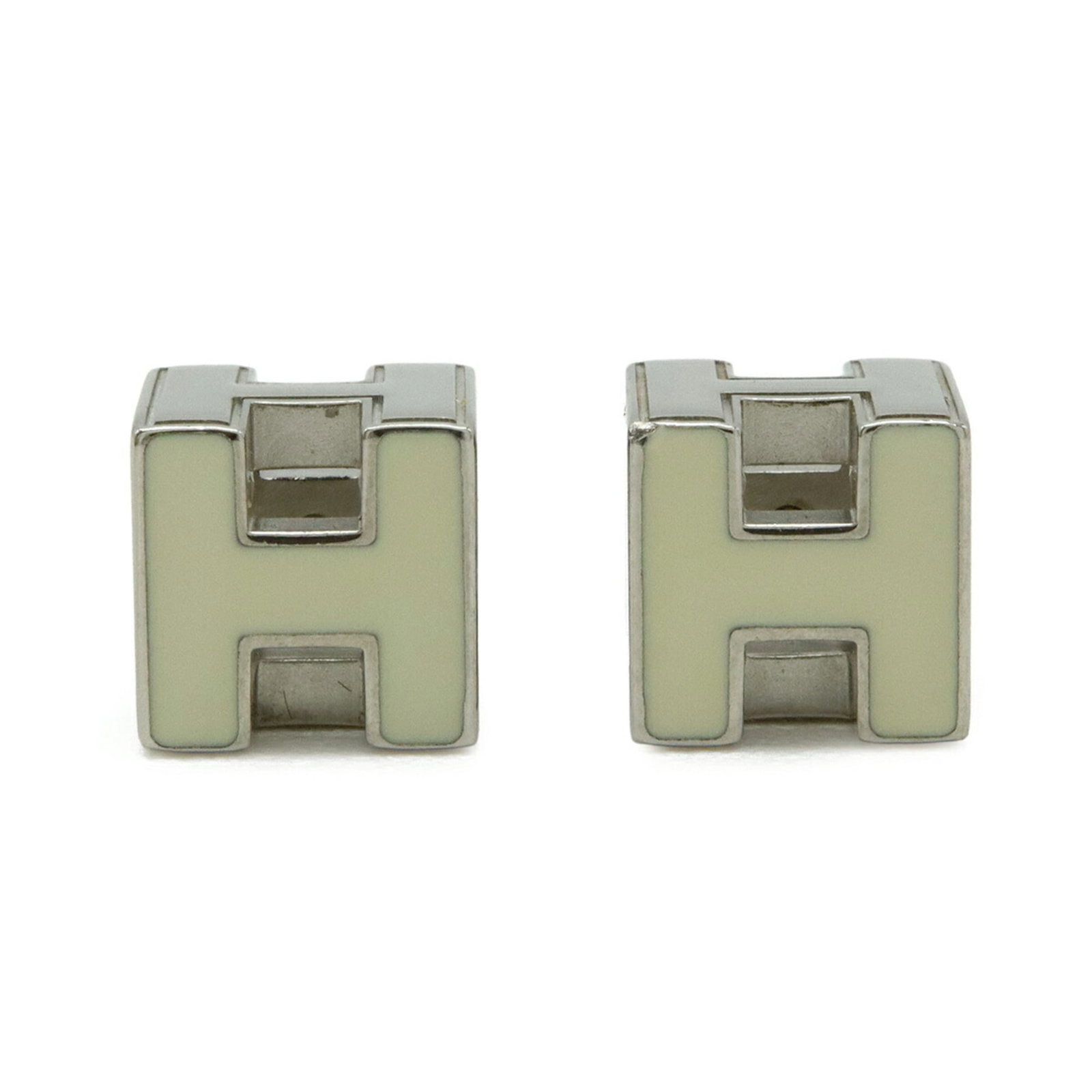 HERMES Stud Earrings Enamel Metal: HERMES Stud Earrings Enamel Metal Stud earrings from the renowned French fashion house Hermes, featuring enamel and metal construction. These silver earrings showcase a classic design with a subtle, e