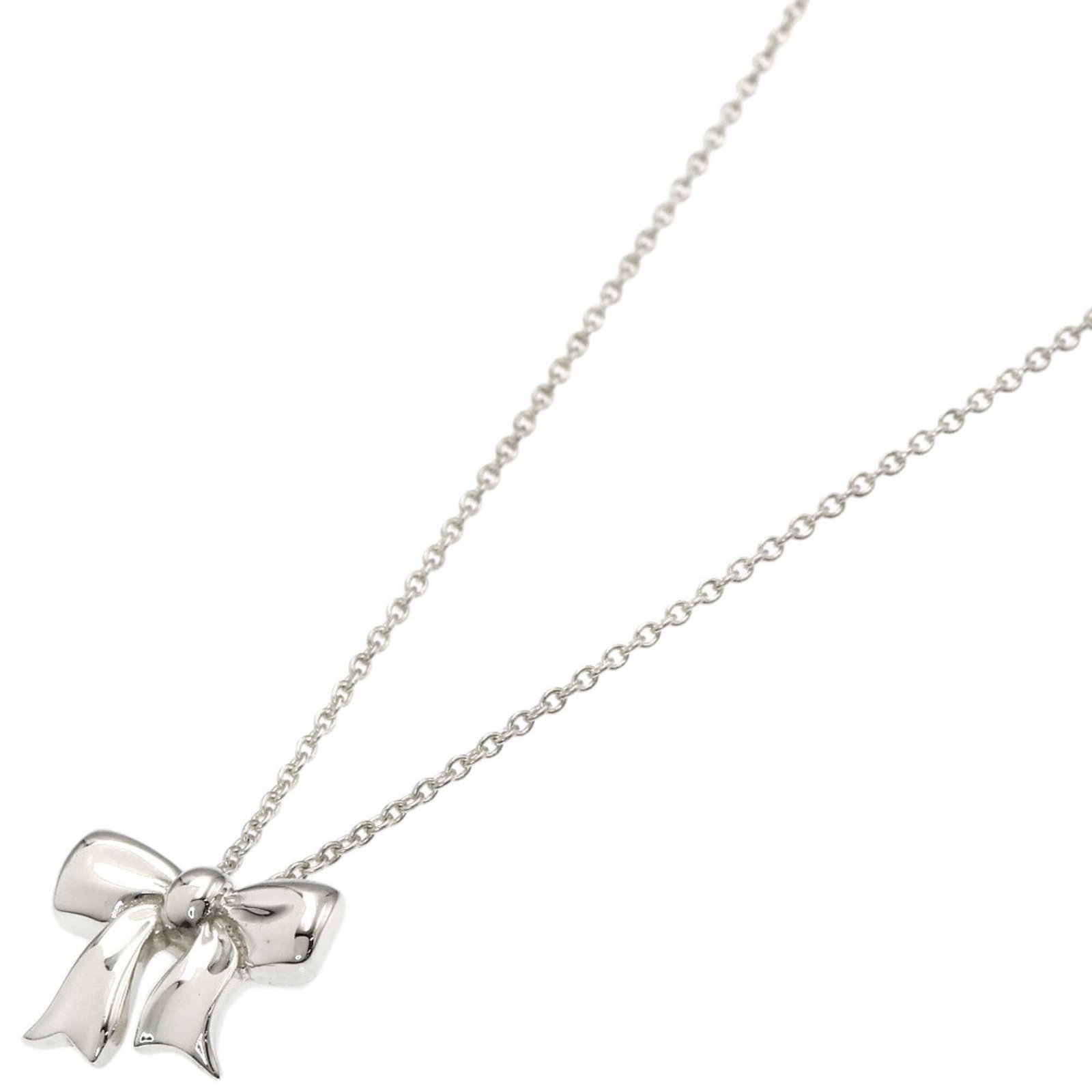 TIFFANY Silver Necklace: TIFFANY Silver Necklace Silver necklace from Tiffany, featuring a 10.5mm x 12.3mm pendant, is available for purchase. Gently used with minor signs of wear, this necklace has a 42.5 cm / 16.73'' circum