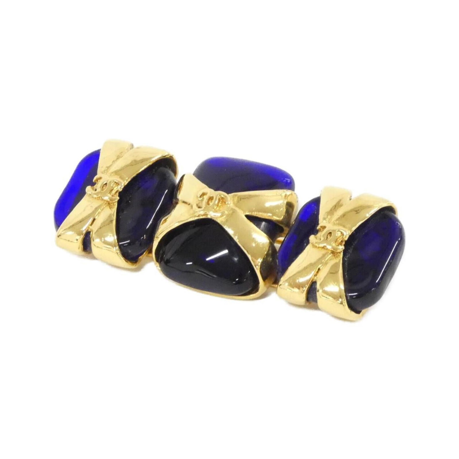 CHANEL Brooch Blue Gold: CHANEL Brooch Blue Gold The CHANEL Brooch Blue Gold is a stunning piece featuring a blue hue and gold accents, showcasing the iconic brand's signature style. With a size of 2.6cm x 6.3cm, this brooch