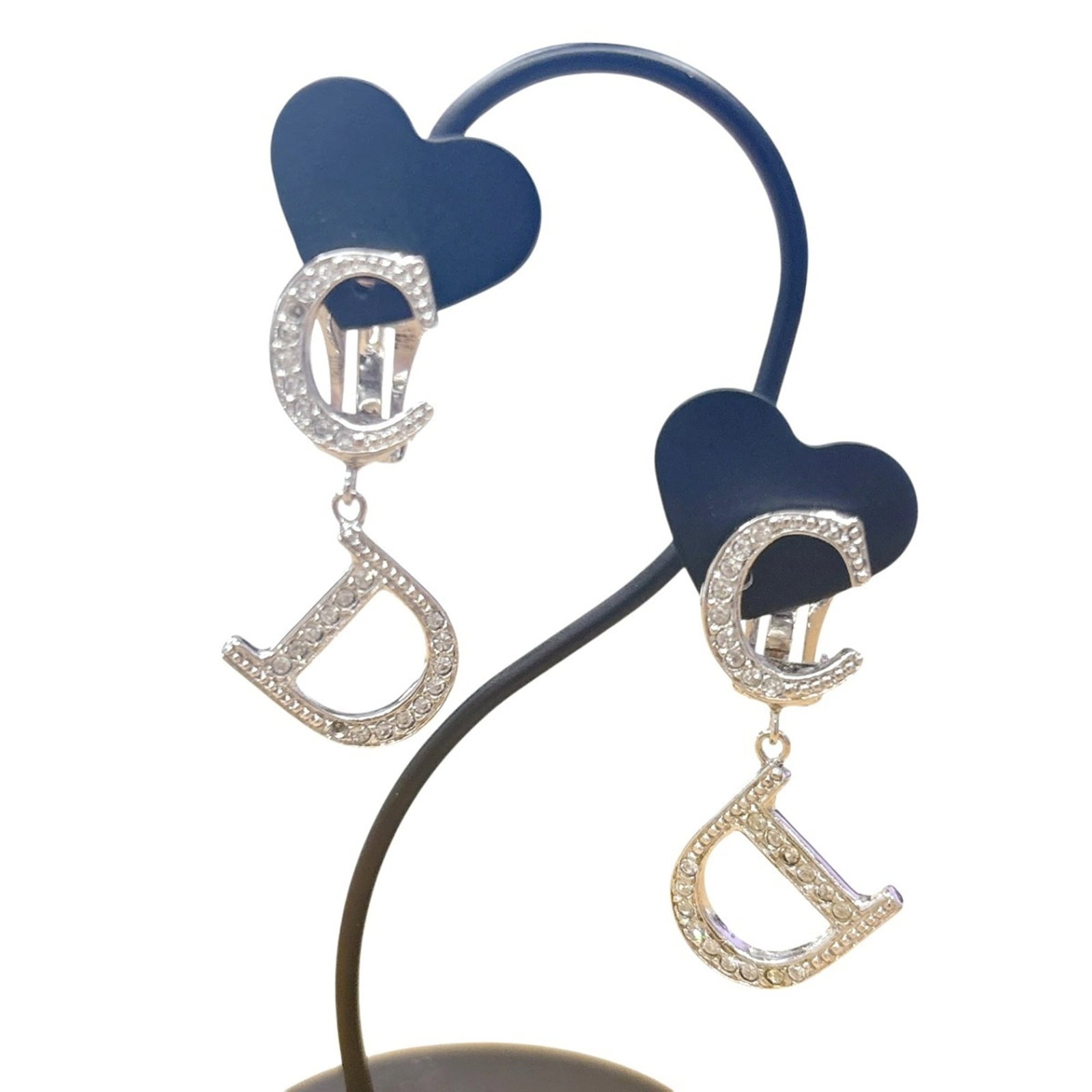 CHRISTIAN DIOR Clip Earrings Rhinestone: CHRISTIAN DIOR Clip Earrings Rhinestone Silver clip earrings adorned with rhinestones from Christian Dior, featuring visible scratches and scuffs. The item is in good condition, with some dirt present