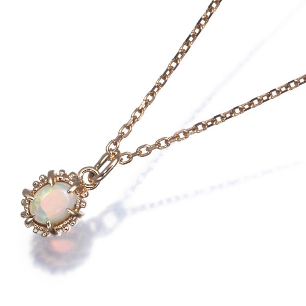 Agete Necklace Opal 10K 416 Yellow Gold: Agete Necklace Opal 10K 416 Yellow Gold Agete Necklace Opal 10K 416 Yellow Gold features a natural opal pendant set in 10k yellow gold. The necklace boasts a 10k metal purity and a classic pendant
