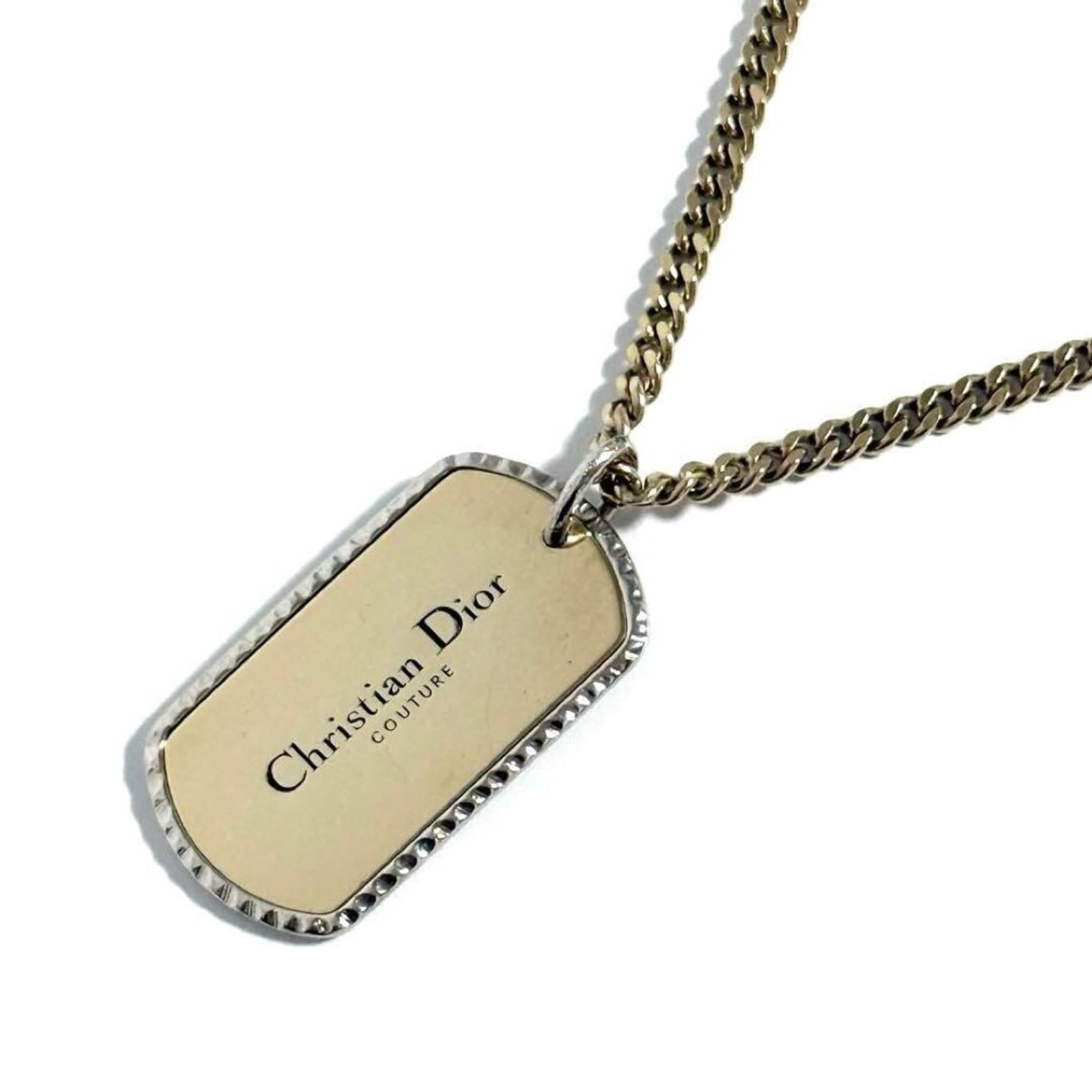 CHRISTIAN DIOR Metal: CHRISTIAN DIOR Metal Christian Dior Metal Pendant Necklace is a stylish accessory featuring a metal design. Available in a range of sizes, this pendant necklace is suitable for men with neck