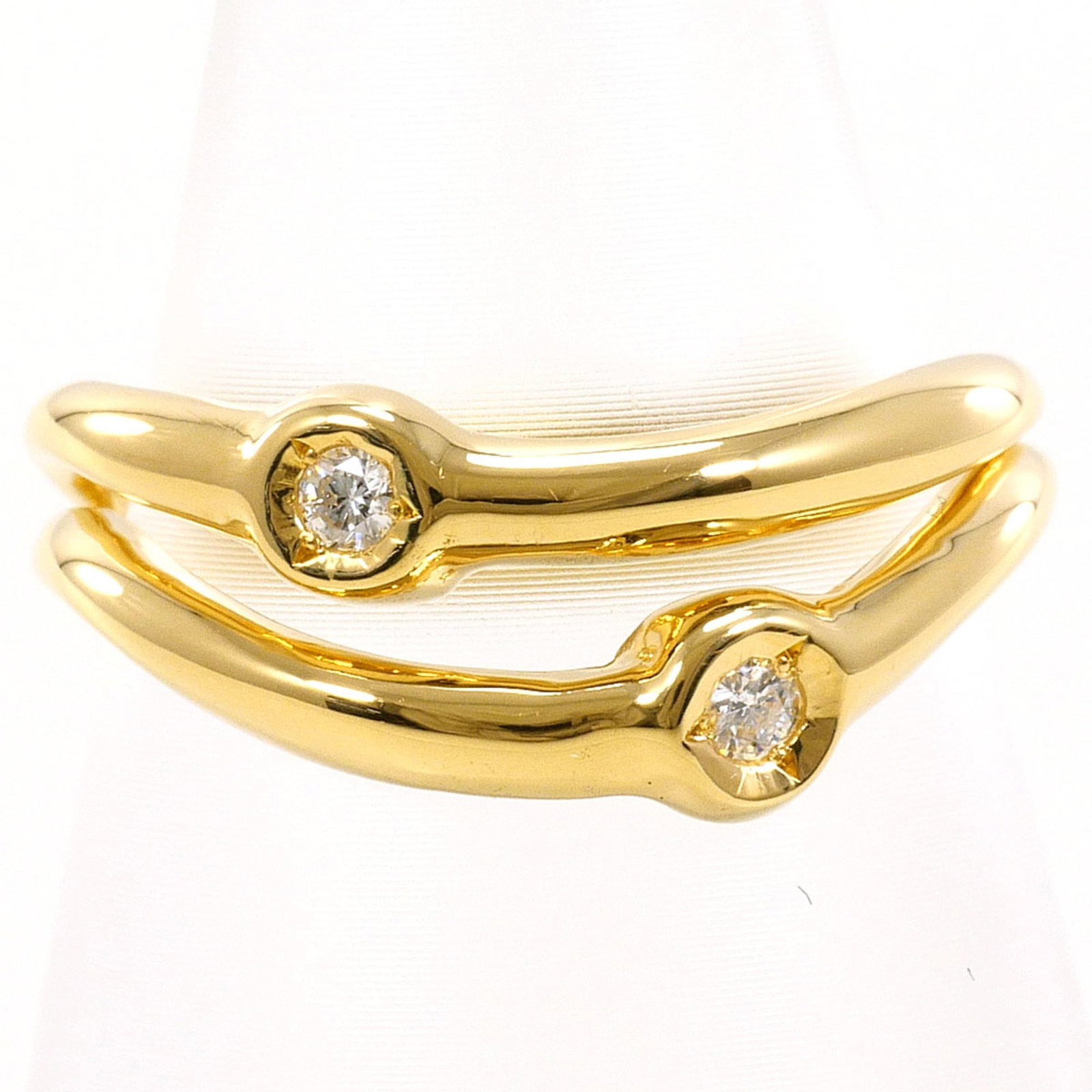Band Ring Yellow Gold (18K): Band Ring Yellow Gold (18K) Yellow gold band ring in excellent condition, featuring 18K gold material and a diamond stone. Weighing 4g, this 5.5 US size ring is a delicate and elegant accessory. Its