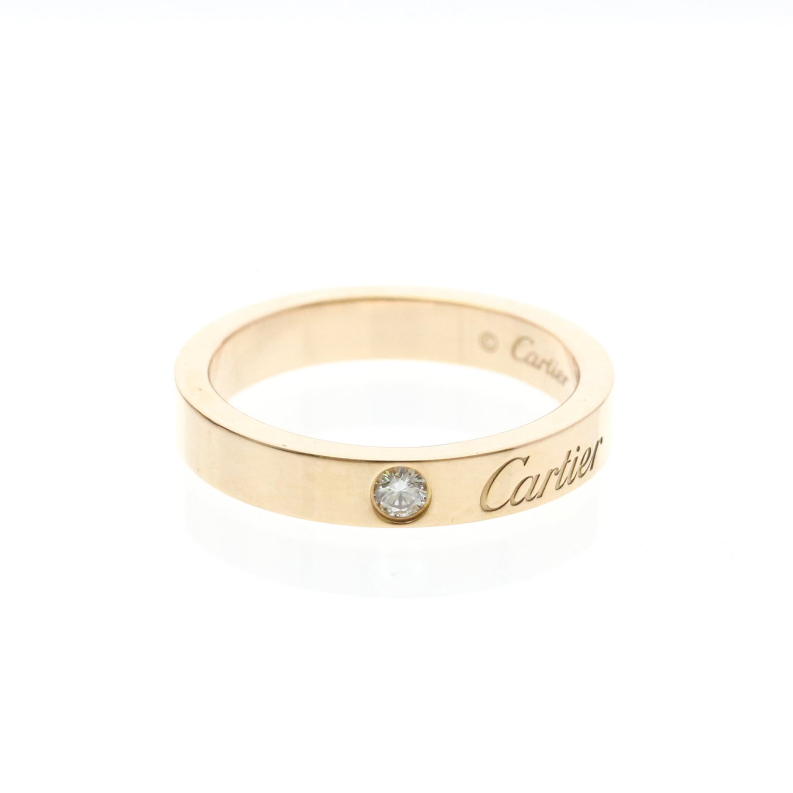 CARTIER Band Ring Pink Gold (18K): CARTIER Band Ring Pink Gold (18K) Pink gold (18K) Cartier C de Cartier ring features a diamond band design, adding a touch of elegance to any outfit. The 18K metal construction and diamond stone provi