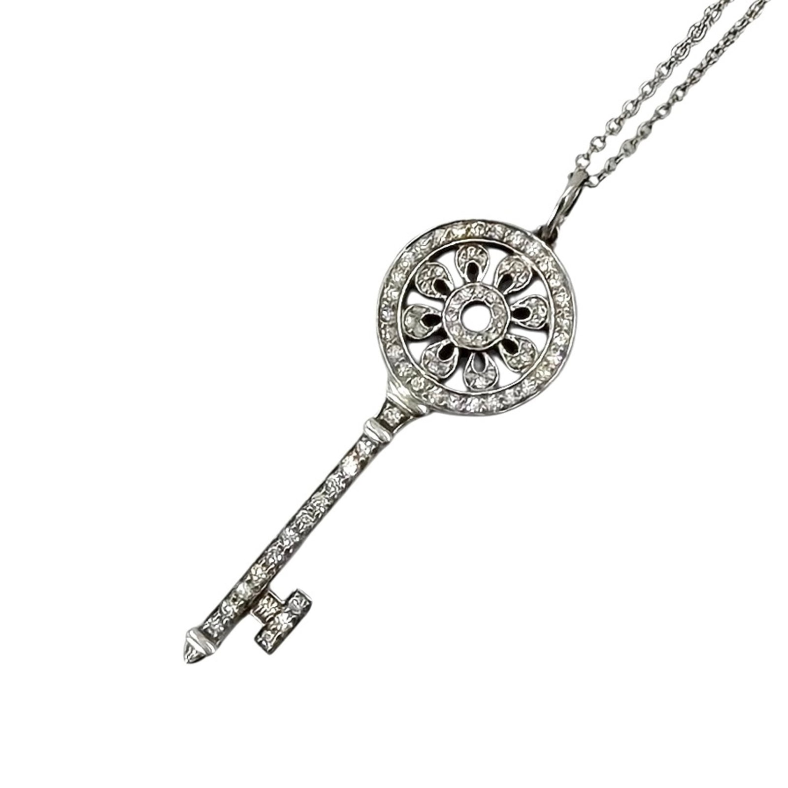 TIFFANY Platinum 950 White Gold (18K): TIFFANY Platinum 950 White Gold (18K) Tiffany's iconic 18K platinum and white gold design makes a statement with its sleek lines and sophisticated elegance. This 36mm x 13mm pendant is a timeless