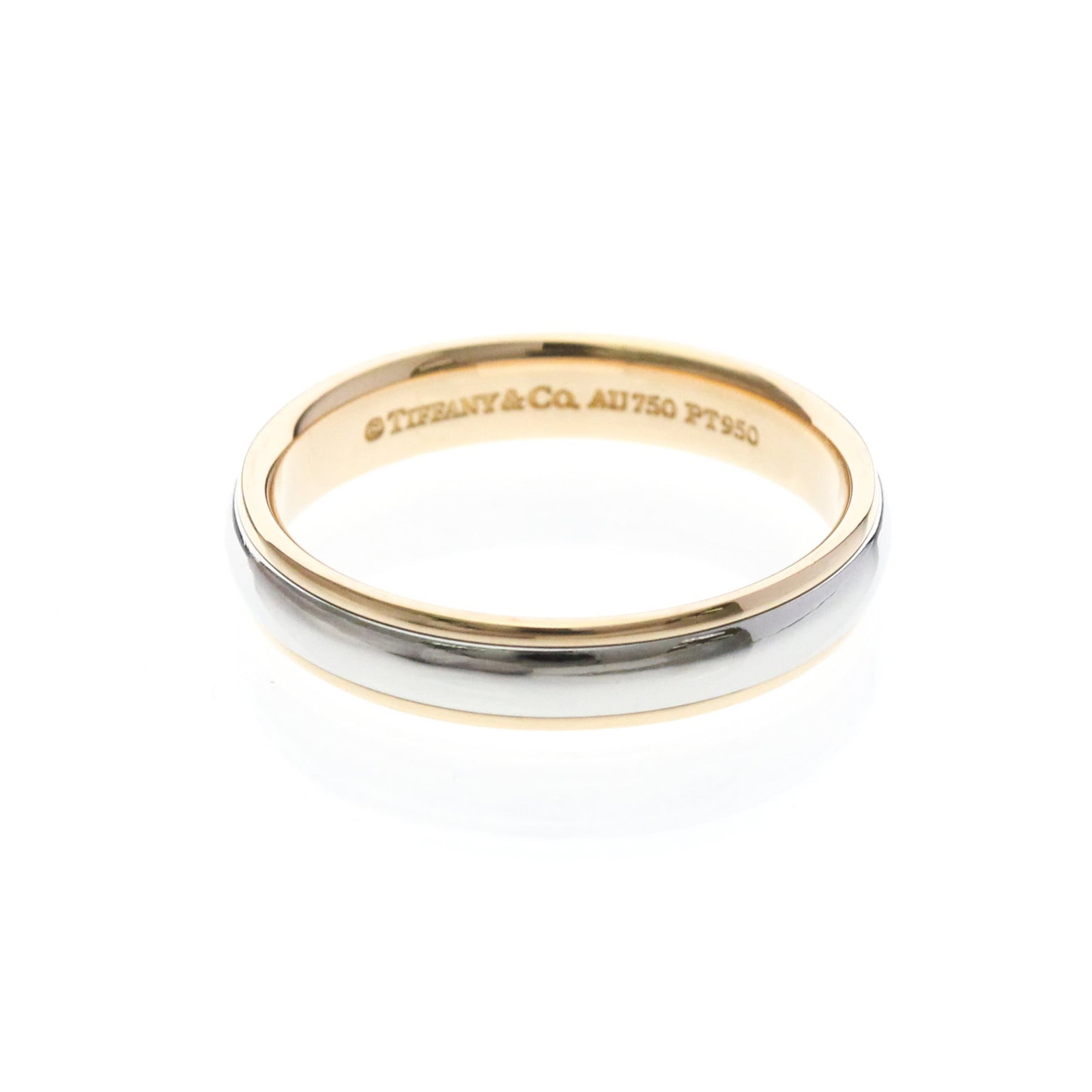TIFFANY Band Ring Pink Gold (18K) Platinum: TIFFANY Band Ring Pink Gold (18K) Platinum Pink gold (18K) Tiffany & Co. band ring with a delicate 4.1mm width, perfect for everyday wear. This gently used ring features minor signs of wear and small