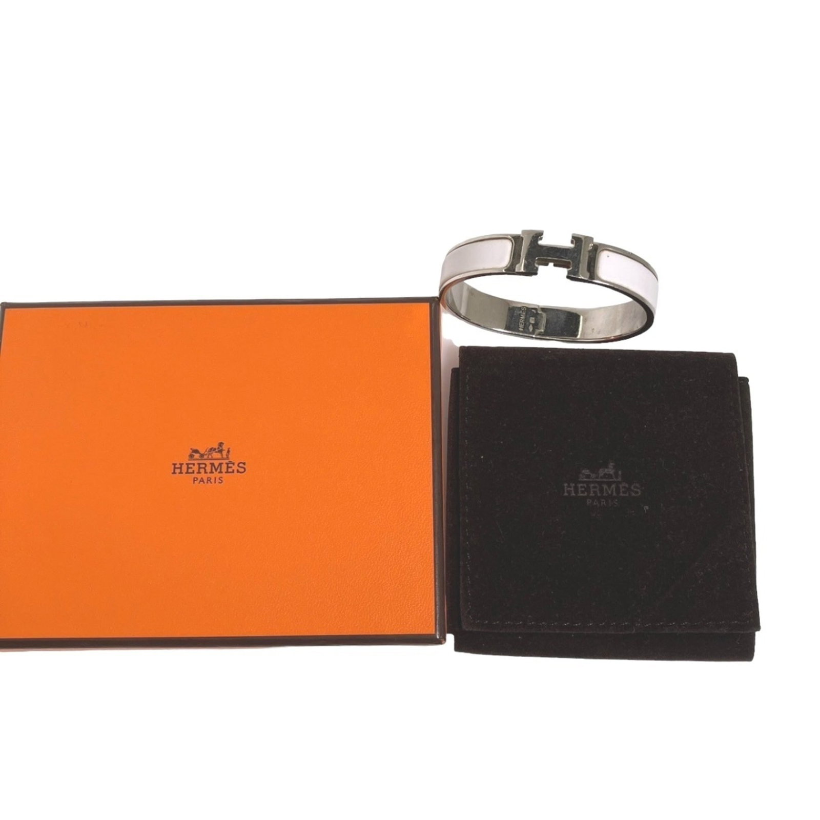 HERMES Bangle Metal: HERMES Bangle Metal This 9-piece Hermes Bangle Metal set is a stylish and versatile accessory, available in silver and white finishes. Gently used with minor signs of wear, each bangle is carefully