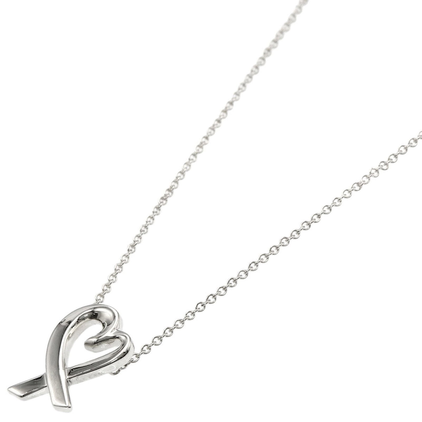 TIFFANY Silver Necklace: TIFFANY Silver Necklace Silver necklace from Tiffany, featuring a 14.8mm x 10.1mm pendant, measures 42 cm in circumference. The necklace is made of silver and bears a minor scratch, with small marks