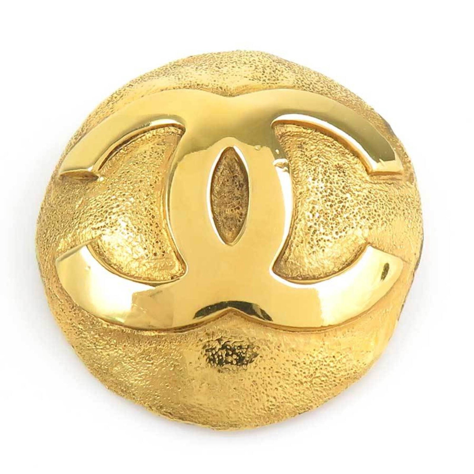 CHANEL Brooch Metal: CHANEL Brooch Metal Gold Chanel Brooch, France. This vintage brooch bears a signature and is made of metal, measuring 4cm x 3.6cm. It features visible scratches and scuffs, indicating its used
