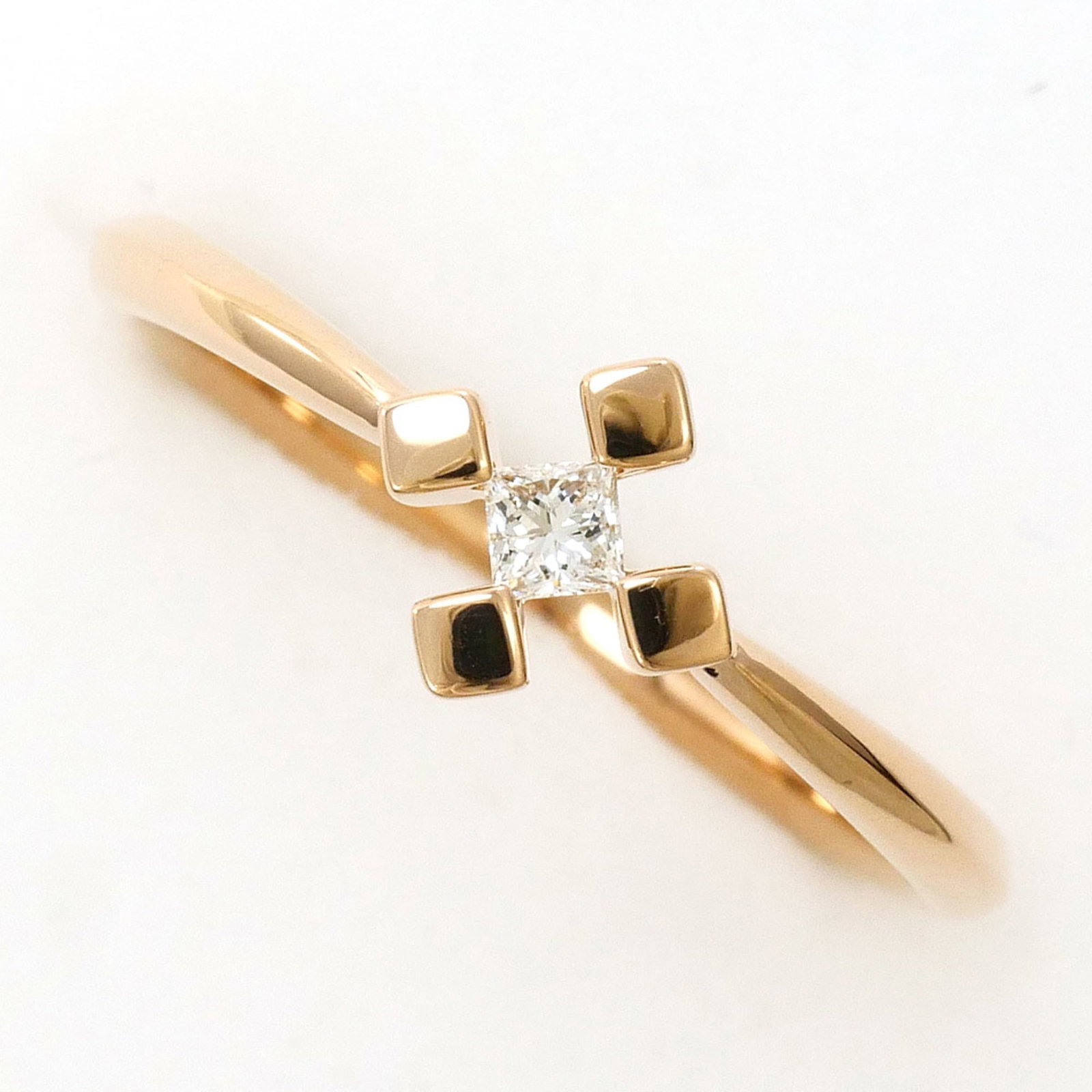 Band Ring Pink Gold (18K): Band Ring Pink Gold (18K) Pink gold 18K band ring with a diamond stone, available in US size 4. The ring features a 6.5mm width and weighs 1.6g, making it a slender yet substantial accessory. In excel