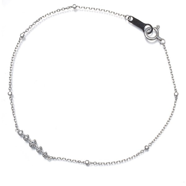 Bracelet Diamond Cut Ball Bead Station 18K 750 White Gold: Bracelet Diamond Cut Ball Bead Station 18K 750 White Gold 18k White Gold Diamond Cut Ball Bead Bracelet with a natural diamond centerpiece, set in a classic station design. The bracelet's 16.5cm inner